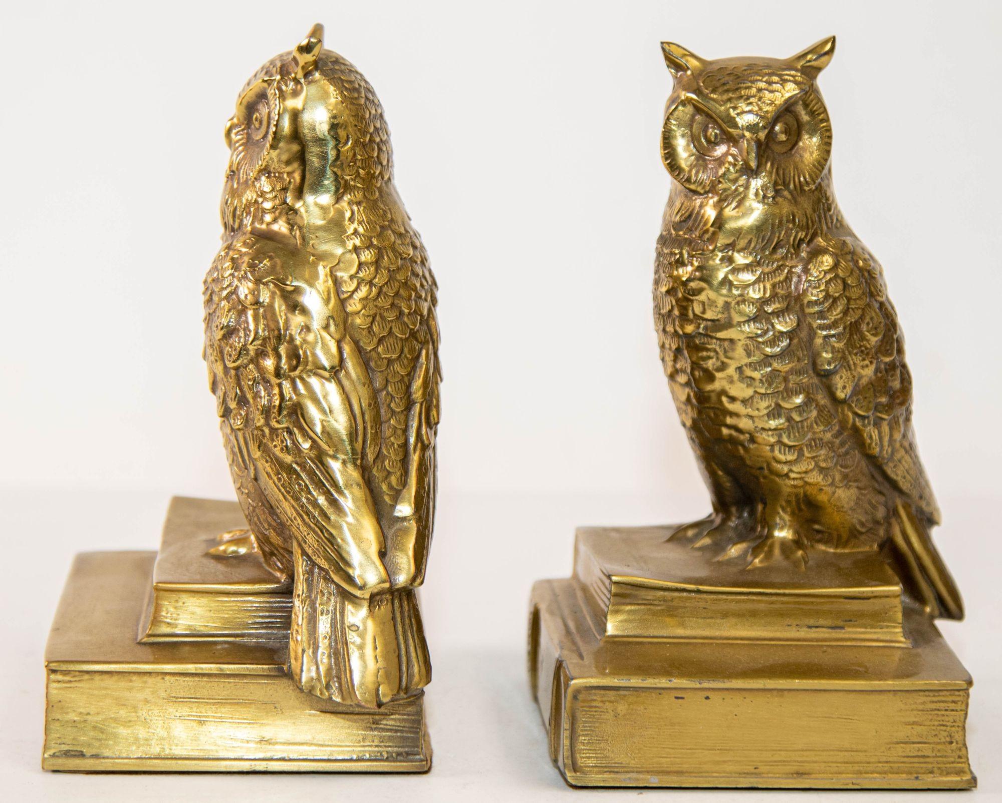 Vintage Cast Brass Owl Figurine Sculpture Bookends Mid-Century Modern a Pair.
Detailed Pair of solid brass book ends in the shape of owl sculptures.
Pair of owl bookends in cast bronze sitting on two history books. 
Vintage Mid-Century Modern