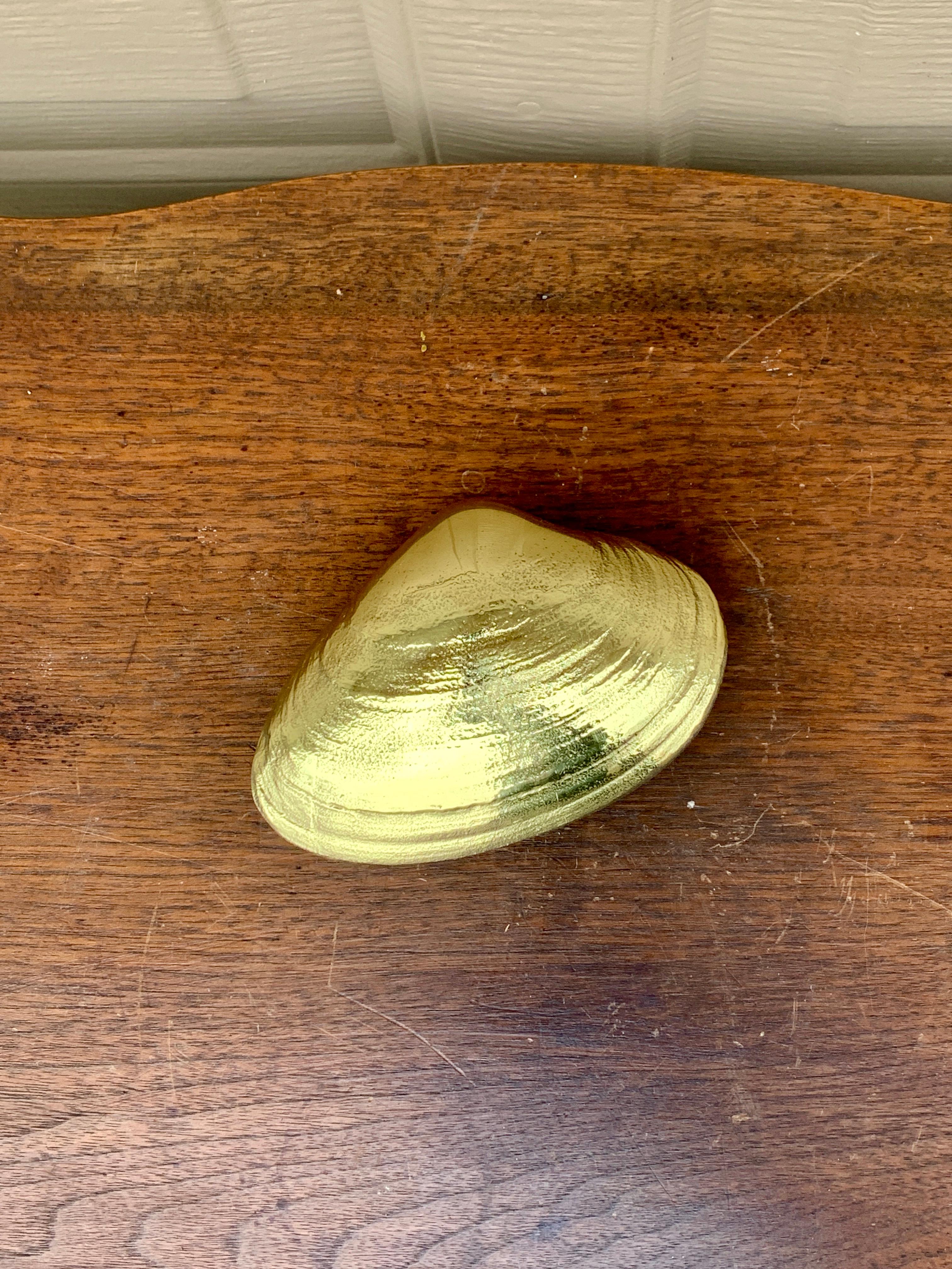 A gorgeous cast brass Quohog clam door knocker, perfect for your Nantucket, Cape, or Hamptons home! This piece was designed by Michael Healy, an accomplished Rhode Island artisan. Michael grew up on Cape Cod and has happy memories of his youth spent