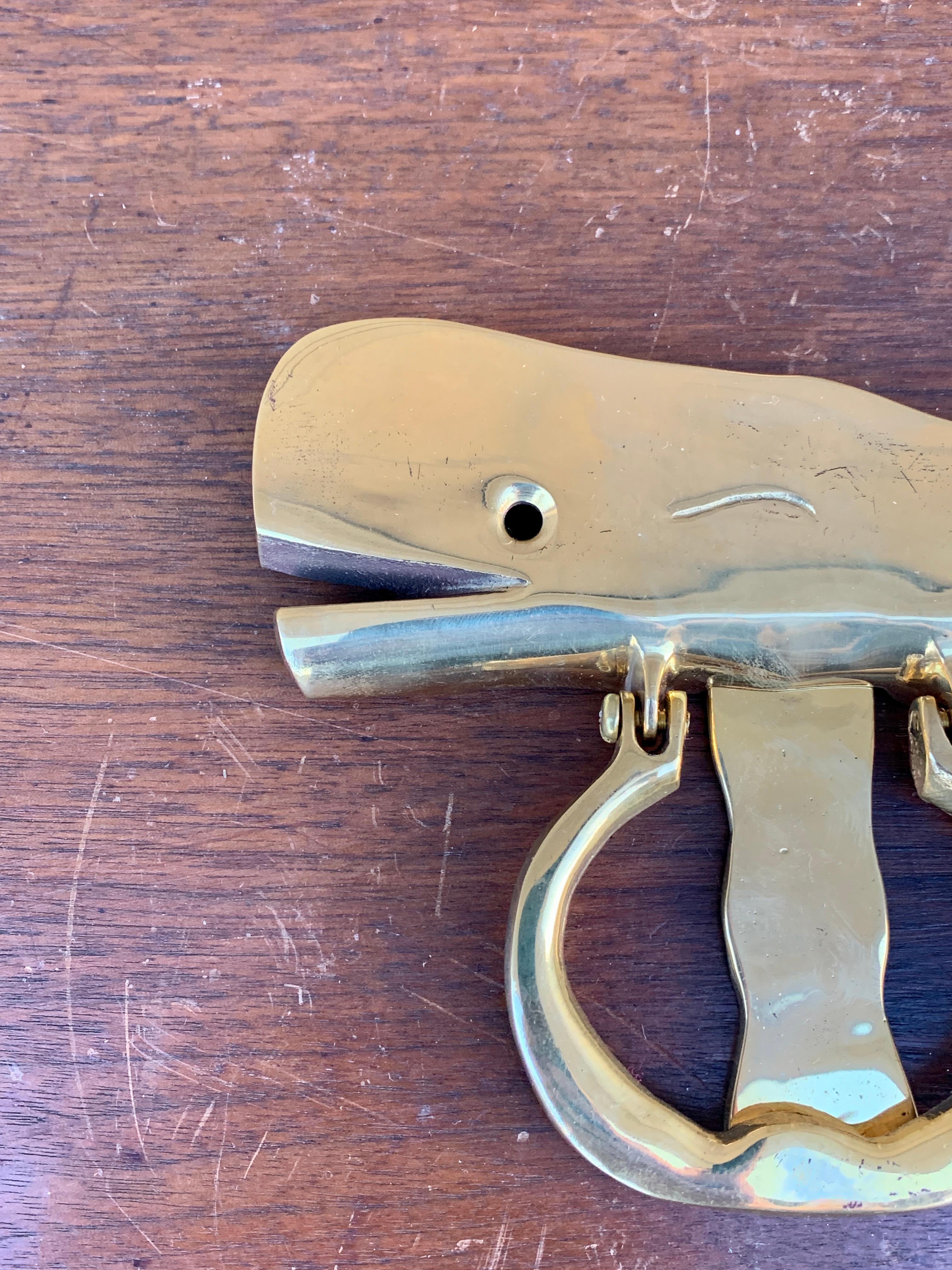 A gorgeous cast brass whale door knocker, perfect for your Nantucket, Cape, or Hamptons home!

USA, Mid-20th Century

Measures: 6.75