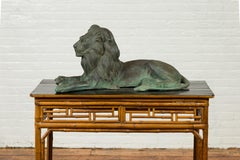 Vintage Cast Bronze Sculpture of a Reclining Lion with Verde Patina