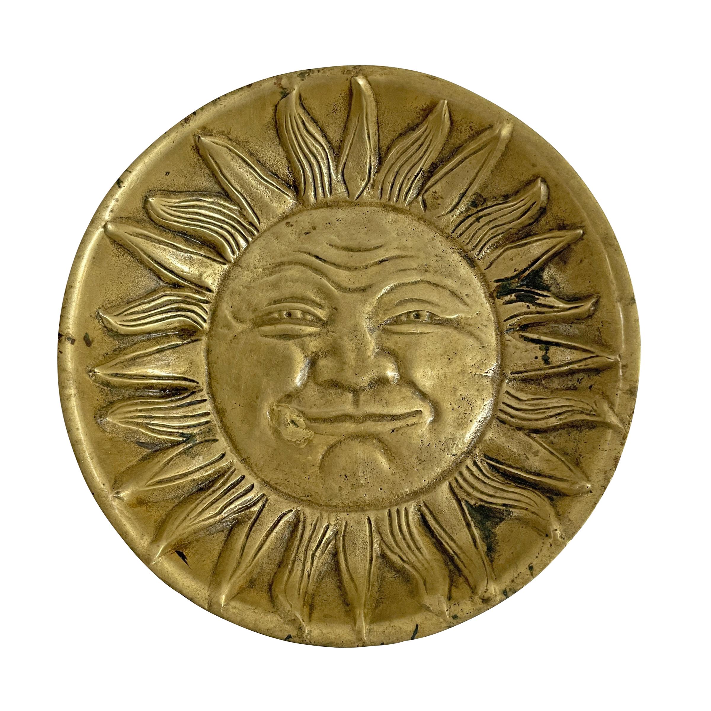A charming 20th century cast bronze catchall with a large smirking sun face in the bottom. This piece is incredibly heavy for its size, and of the best quality casting! Perfect for holding your keys, pocket change, or any vices you may have.