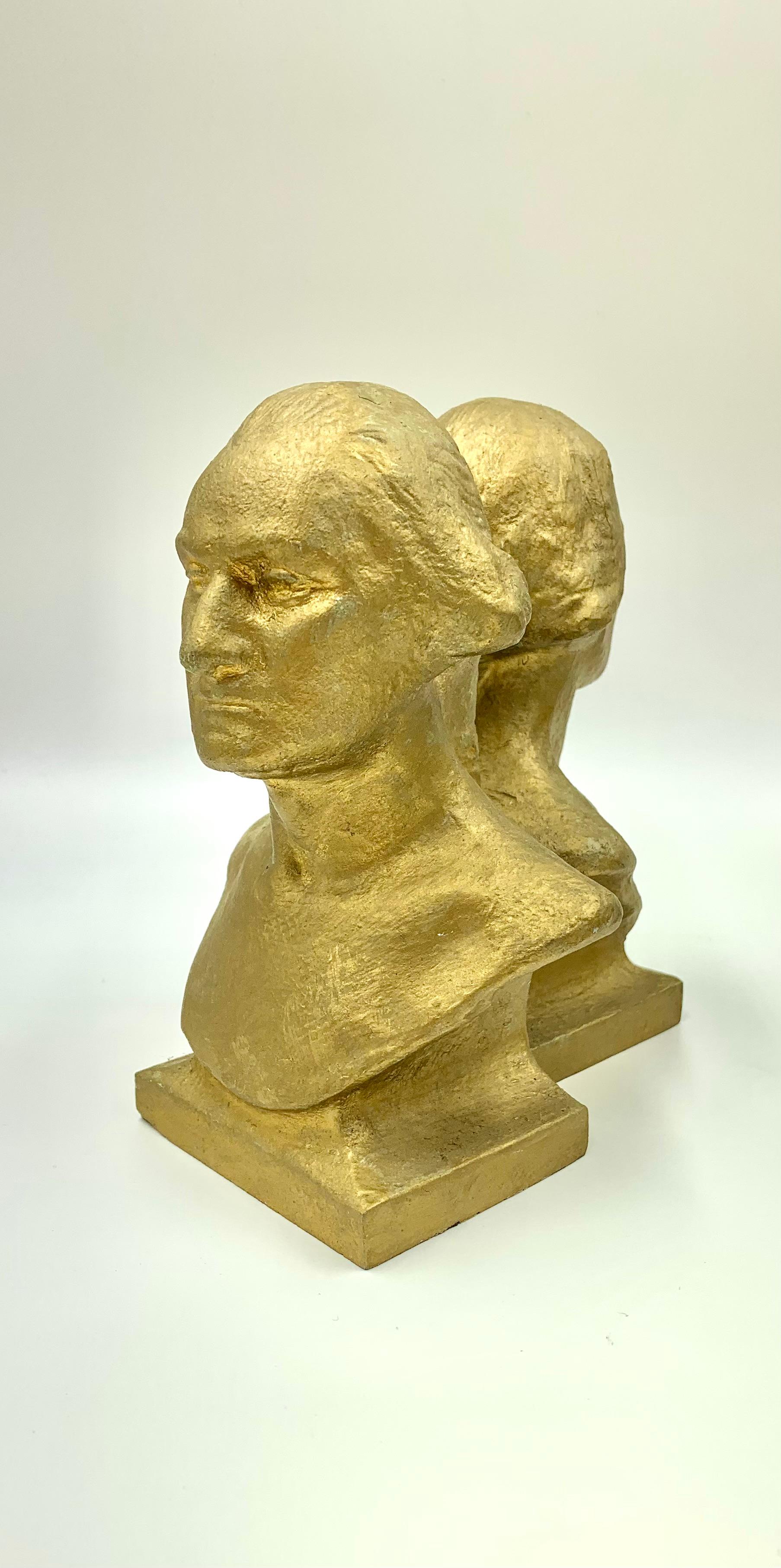 Pair of American Classical vintage cast iron bookends depicting the bust of George Washington afer the late 18th century model by Jean Antoine Houdon.
Early 20th Century
Attractive pair of gilt decorated patriotic American cast iron bookends of the