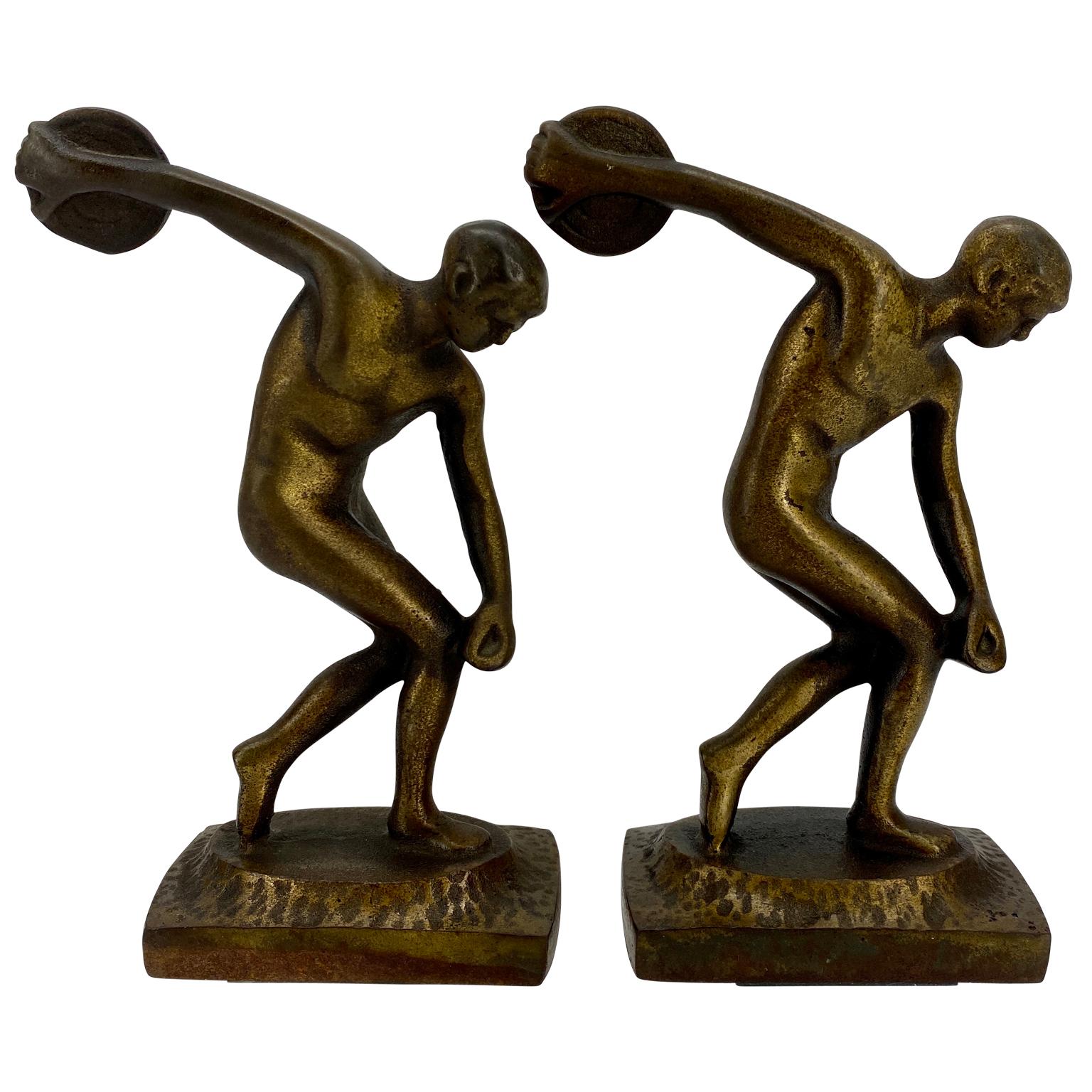 Spectacular antique pair of Jennings Brothers discus throwing nude male bookends. Bronzed cast iron well aged with a vintage patina. This is a strong, masculine statement for any bookcase or desk. The bookends are heavy, sturdy and strong.
