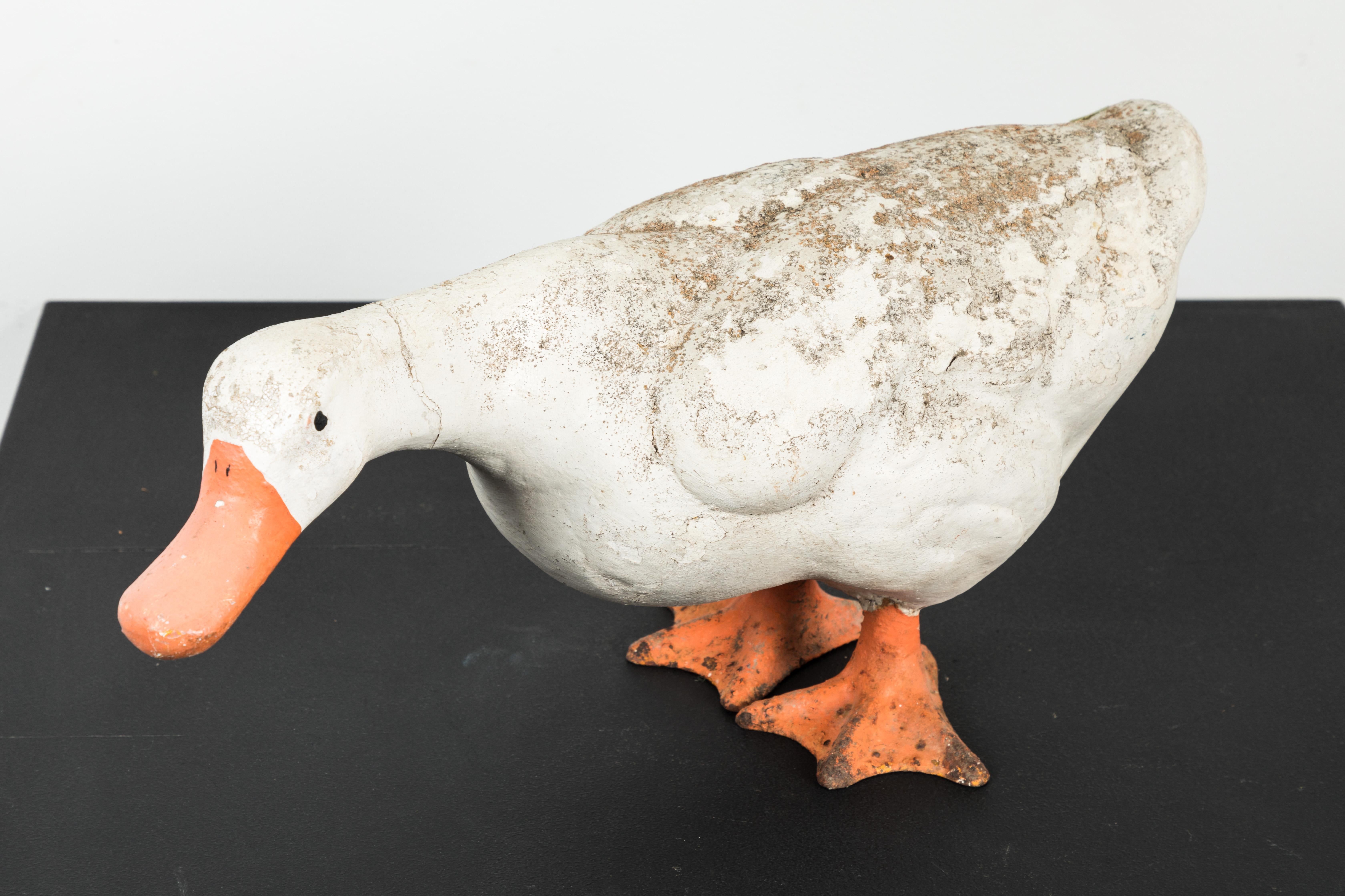 vintage concrete duck statue