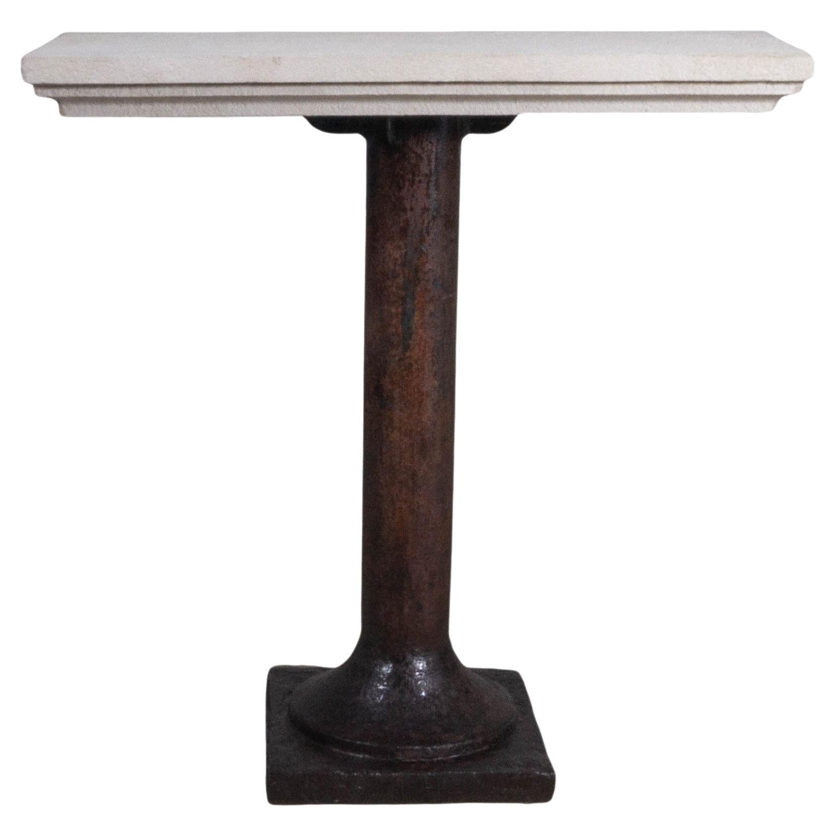 Vintage Cast Iron Architectural Column Supporting a Limestone Top For Sale