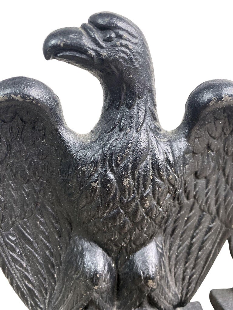 Offered is a pair of cast iron eagle bookends from the 1950s. These bookends each feature a perched eagle with large tucked wings. The eagles' heads look to the right. The details on the wings and talons are distinctive. The bookends are sturdy and