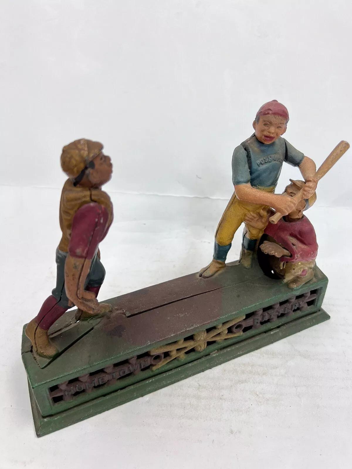 Vintage Cast Iron Book Of Knowledge Hometown Batter Coin Piggy Bank. Circa Late 20th Century. Measurements: 7