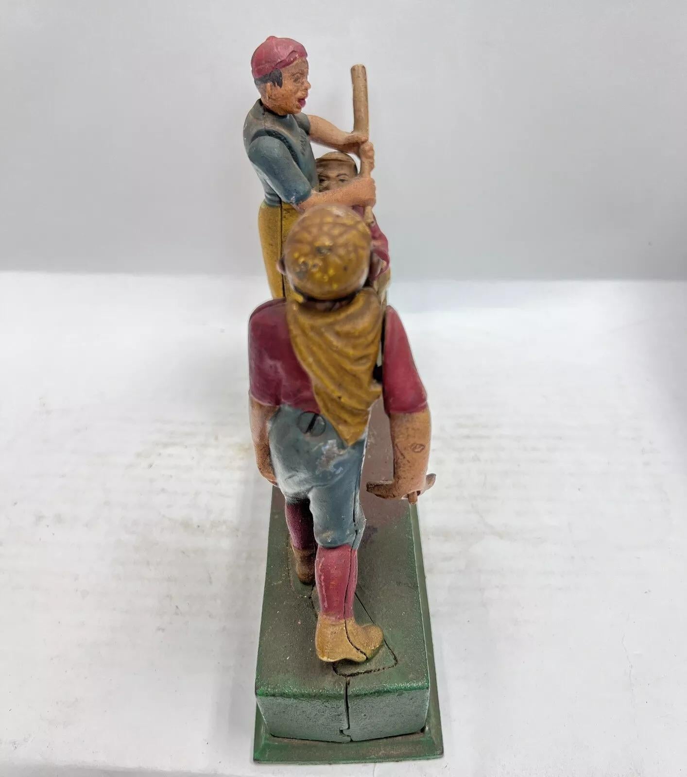 Vintage Cast Iron Book Of Knowledge Hometown Batter Coin Piggy Bank In Good Condition For Sale In Philadelphia, PA