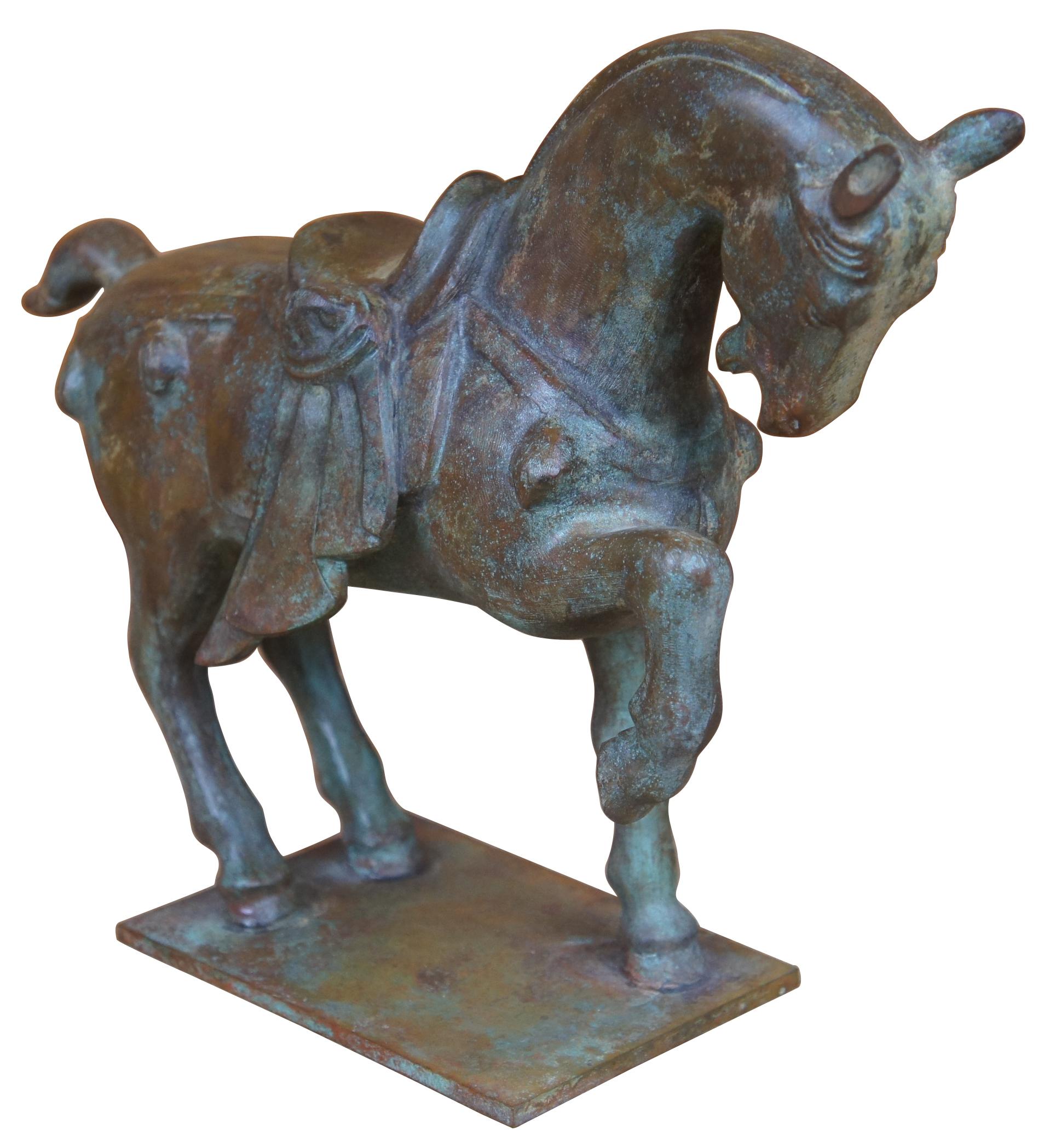 Vintage cast iron sculpture in the form of a Tang Dynasty War horse. Measures: 12