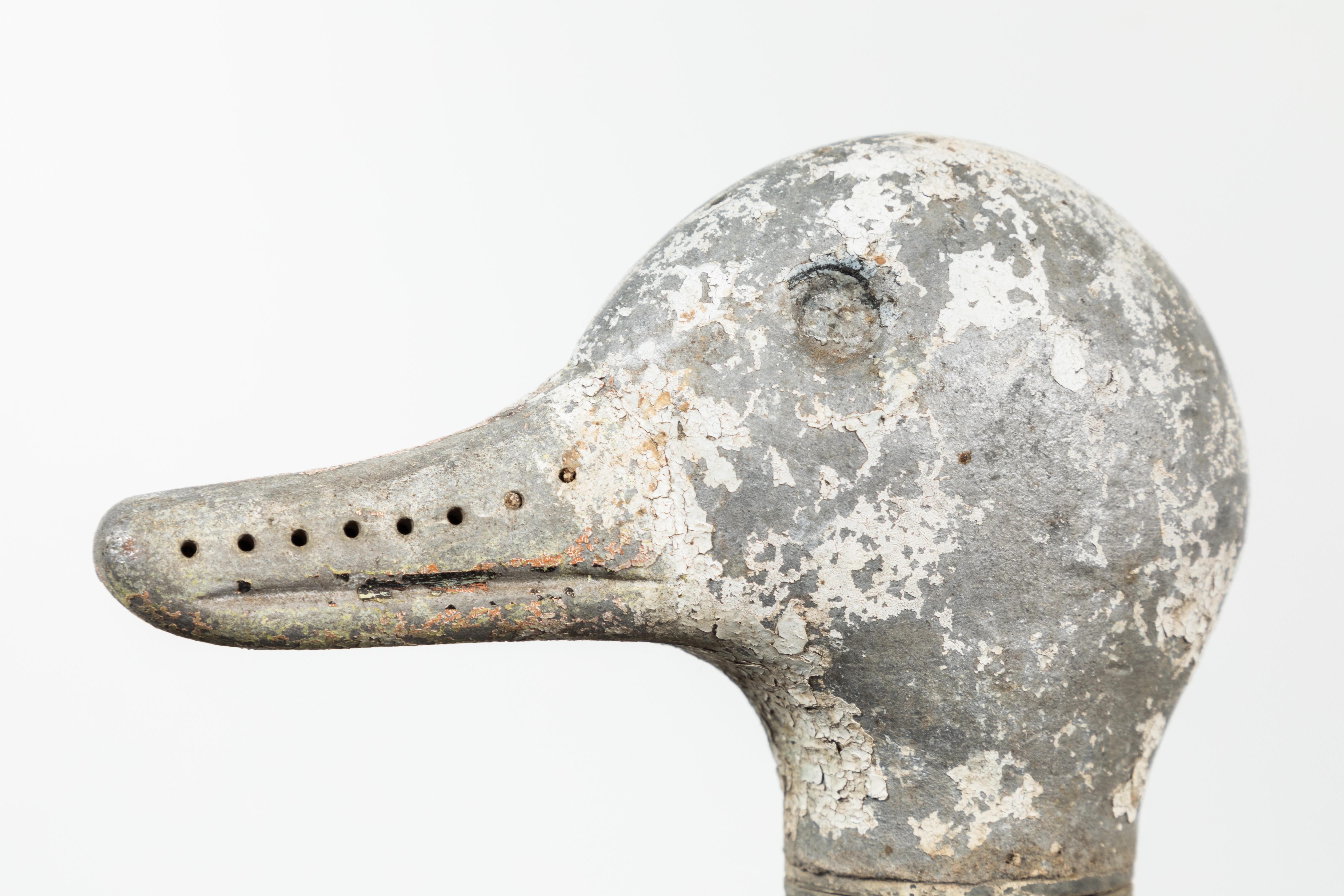 Fun vintage iron duck sprinkler. The head of this circa 1940s duck lawn sprinkler would spin as the water would shoot from holes along the top of the head and the beak.