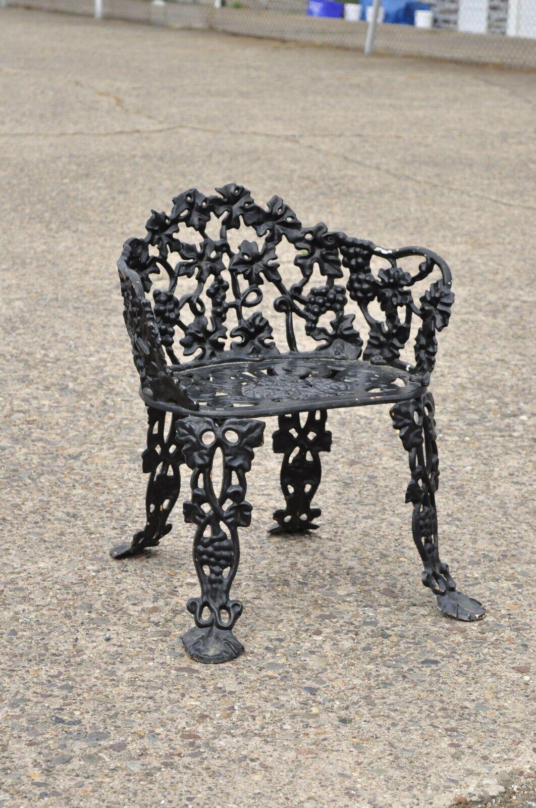 Vintage cast iron French Victorian grapevine small garden accent side chair. Item features a grapevine pattern with rare grapevine seat, cast iron construction, very nice antique item, great style and form. Circa early to mid-20th century.