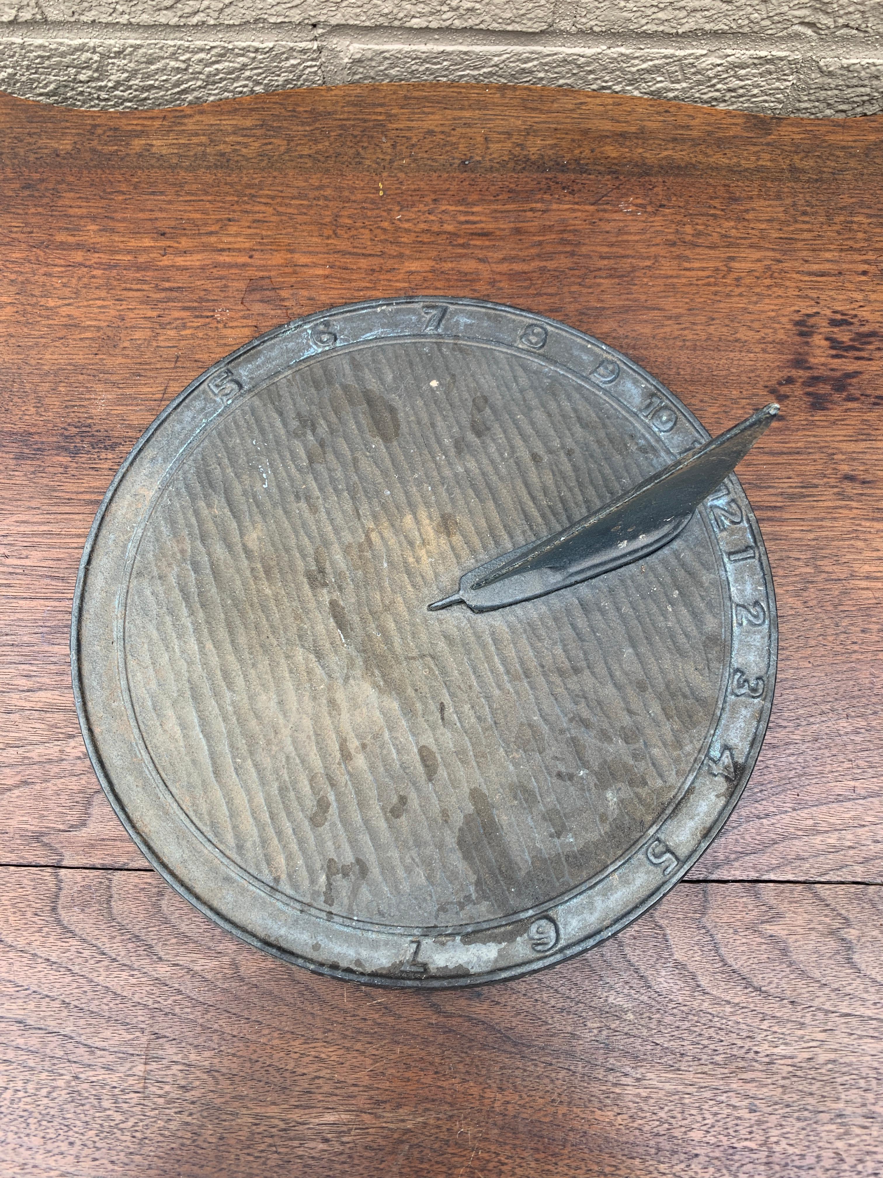 A beautiful vintage cast iron nautical garden sundial with a sail boat

USA, Late 20th Century

Measures: 9.5