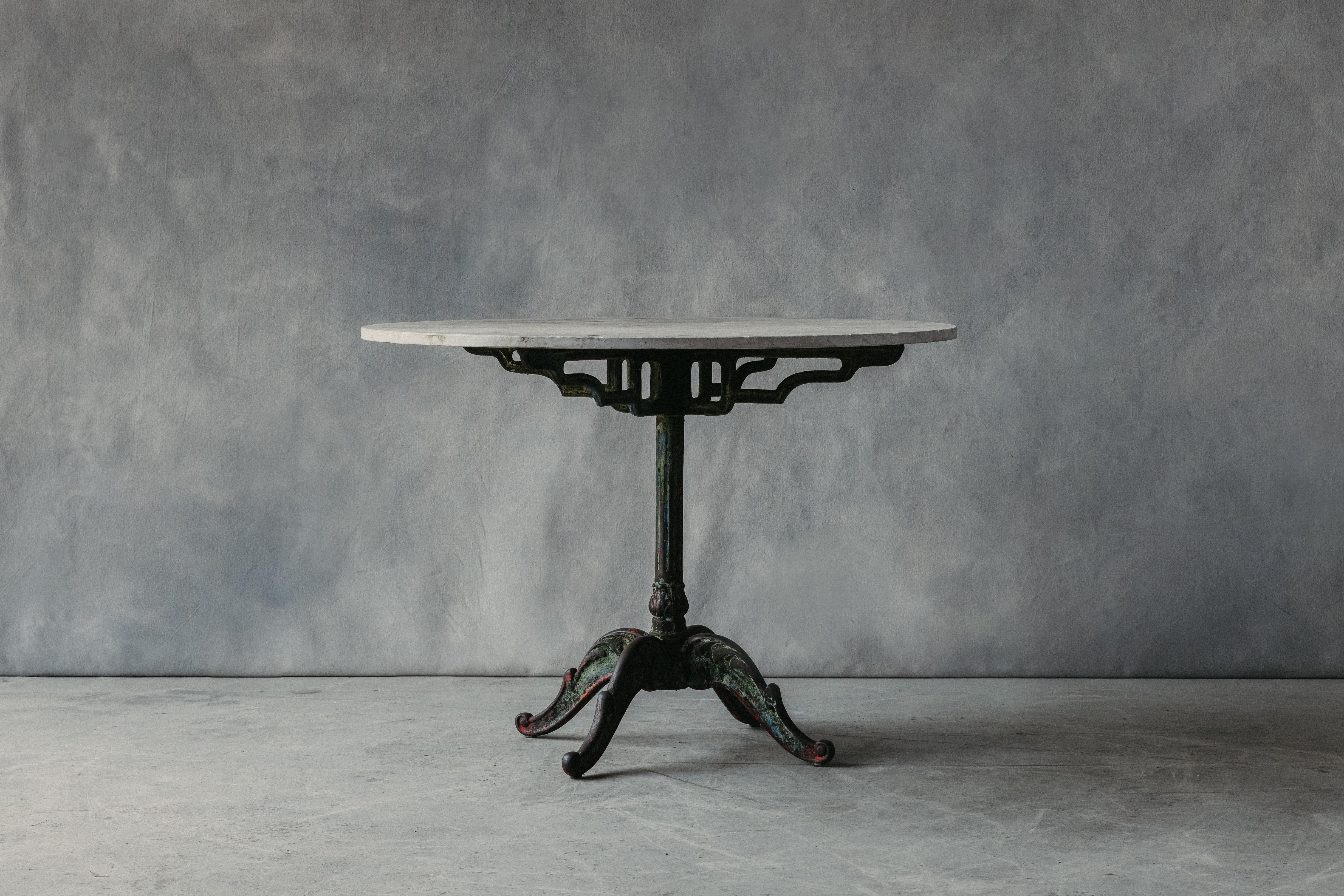 Vintage Cast Iron Garden Table From France, Circa 1940.  Solid cast Iron base with fantastic original color and patina.  Marble top in good condition with age related use and wear.