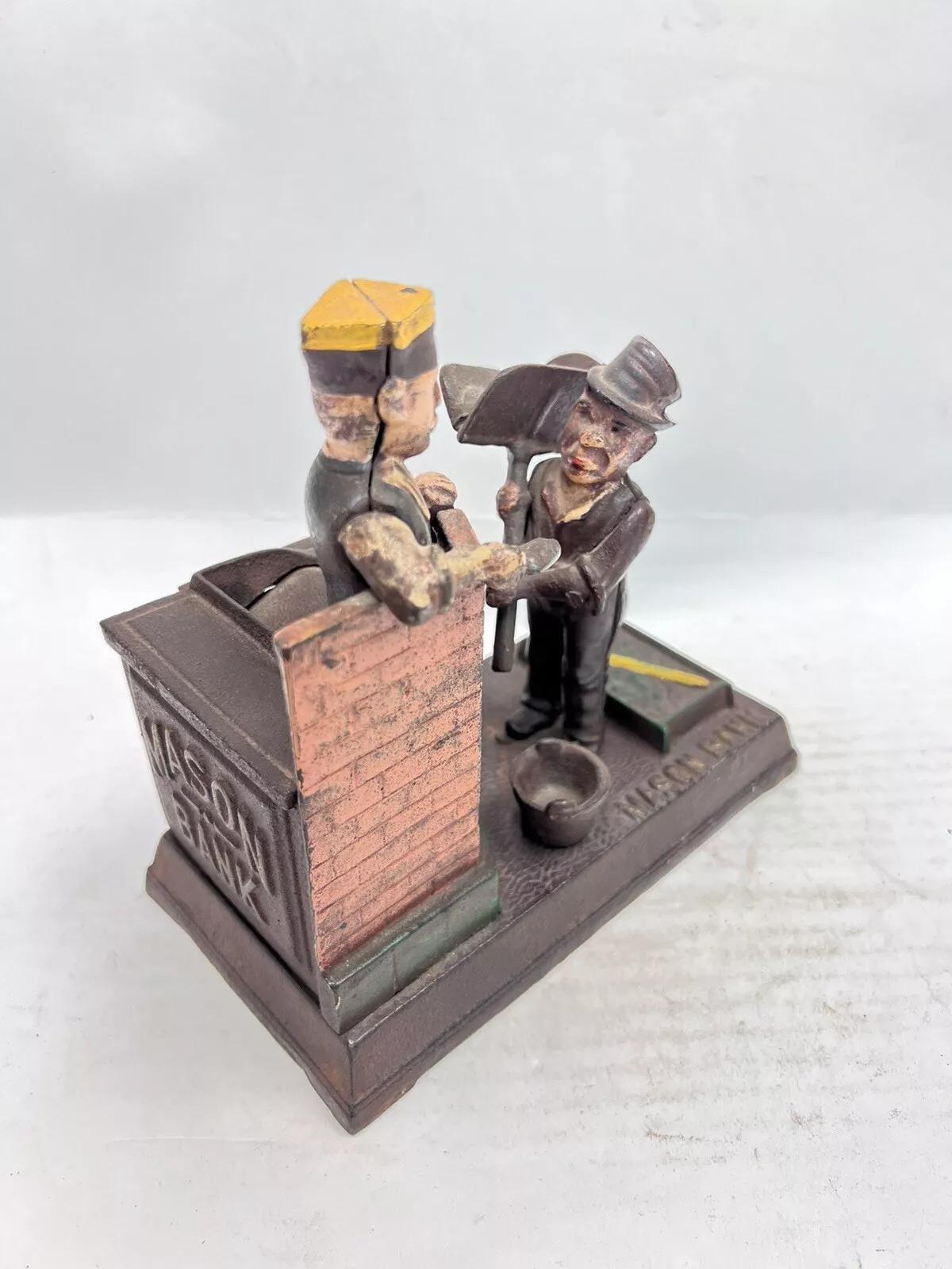 Vintage Cast Iron Mason Coin Piggy Bank Reproduction. Circa Late 20th Century. Measurements: 7.25