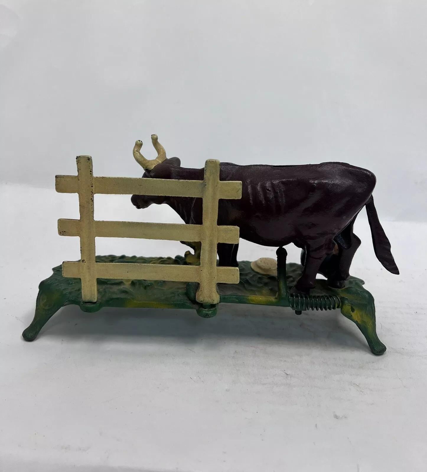 Vintage Cast Iron Mechanical Bank Book of Knowledge Kicking Milking Cow In Good Condition For Sale In Philadelphia, PA