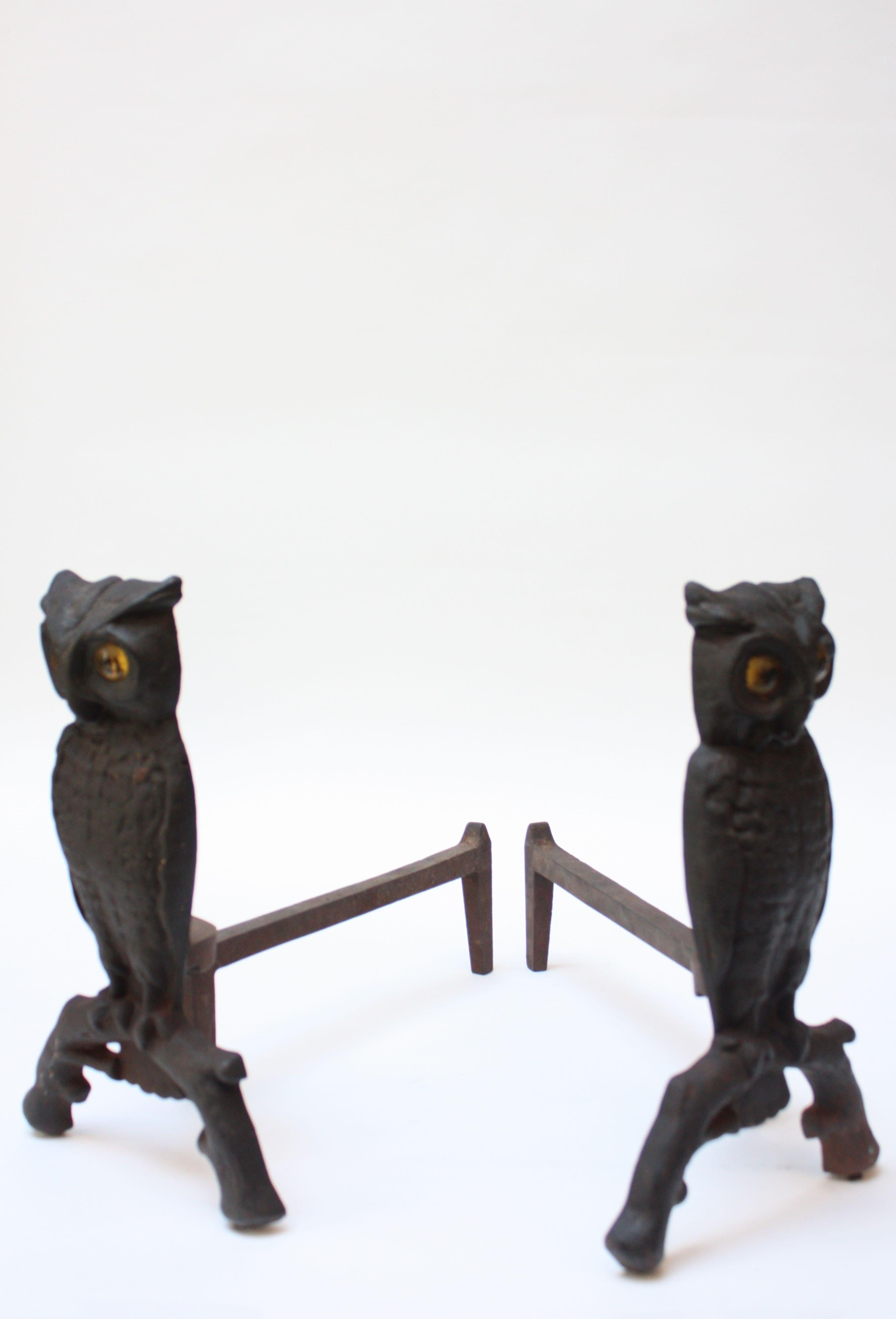 owl andirons with glowing eyes