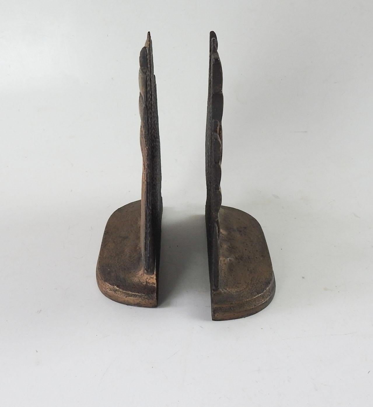 Vintage pair of cast iron sailing ship bookends. Marked Bron Met on back, overall wear to gold painted finish, felt bottoms missing.