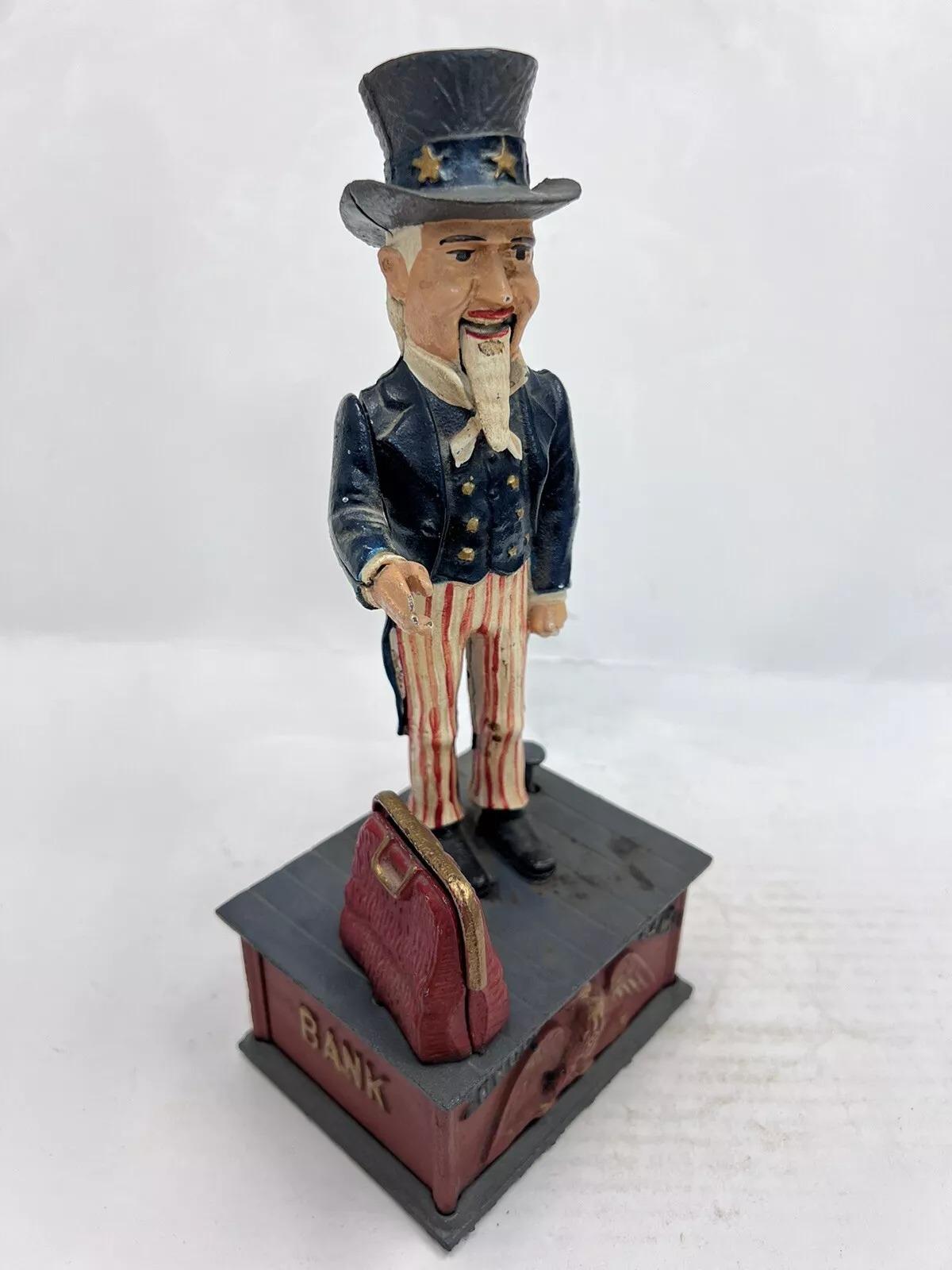 Vintage Cast Iron Still Bank Uncle Sam Novelty Bank Book of Knowledge. Circa Late 20th Century. Measurements: 11.5