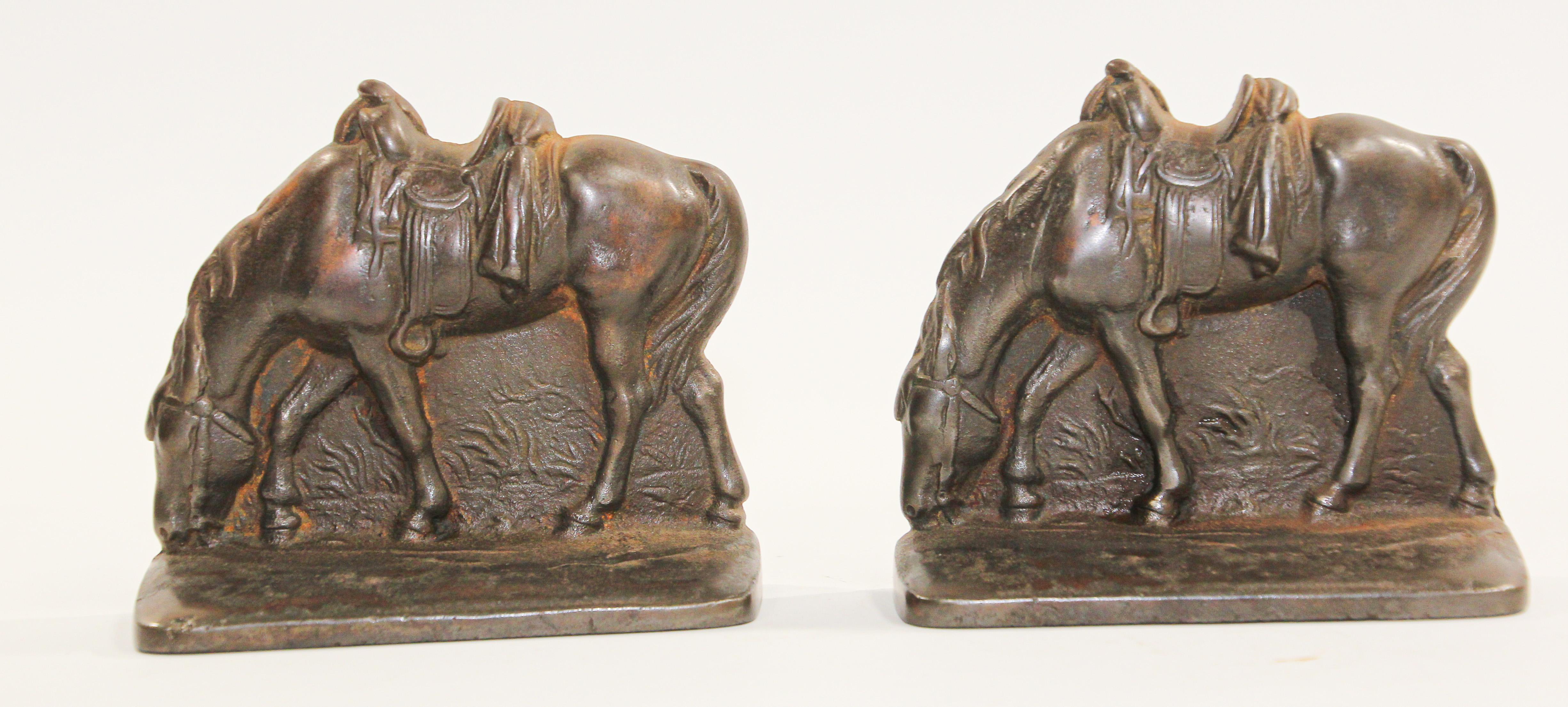 Vintage cast iron western-style horse bookends.
Pair of cast iron saddled grazing horse bookends heavy western equestrian style.
Great to use on a desk as a paper weight or decorative objects around the house or office.
Measures each: 5