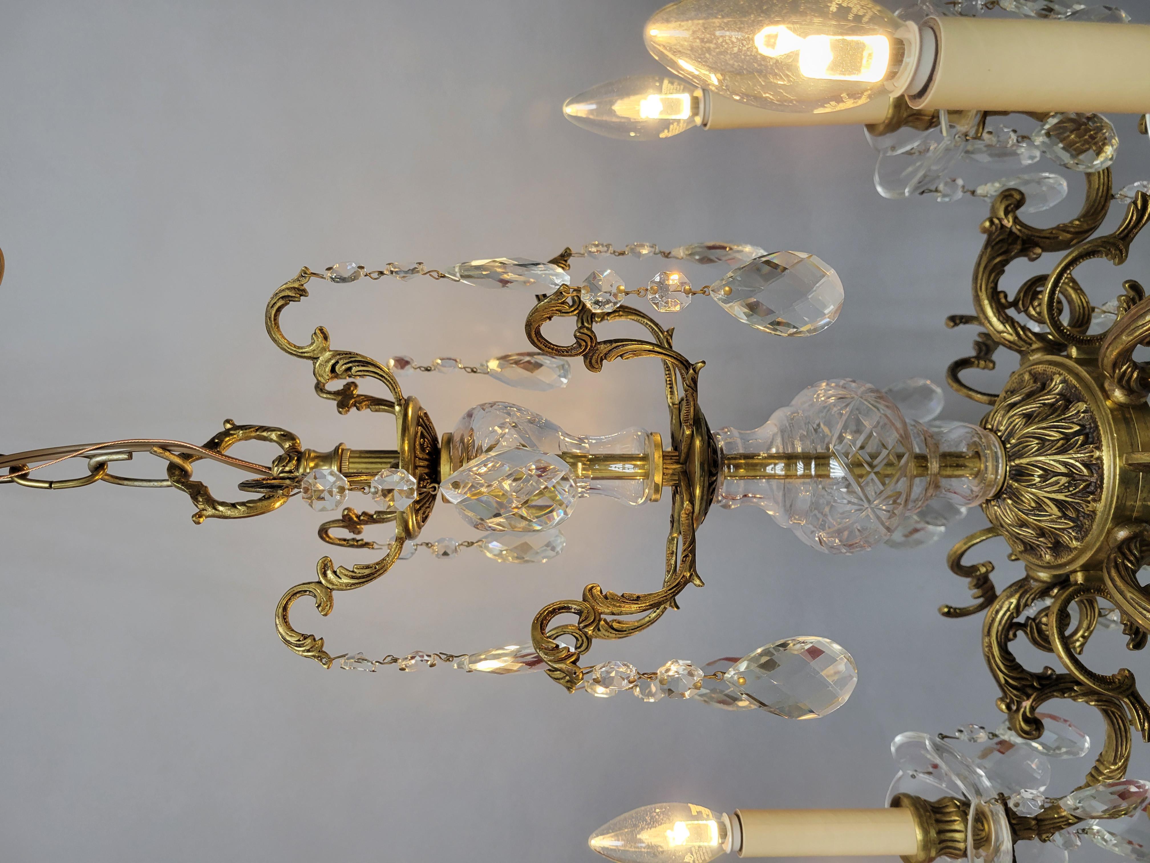 Add a touch of timeless elegance to your home with this stunning Vintage Cast Spanish Brass Chandelier. Expertly crafted from solid brass, this exquisite piece showcases intricate detailing and classic Spanish design elements that exude old-world