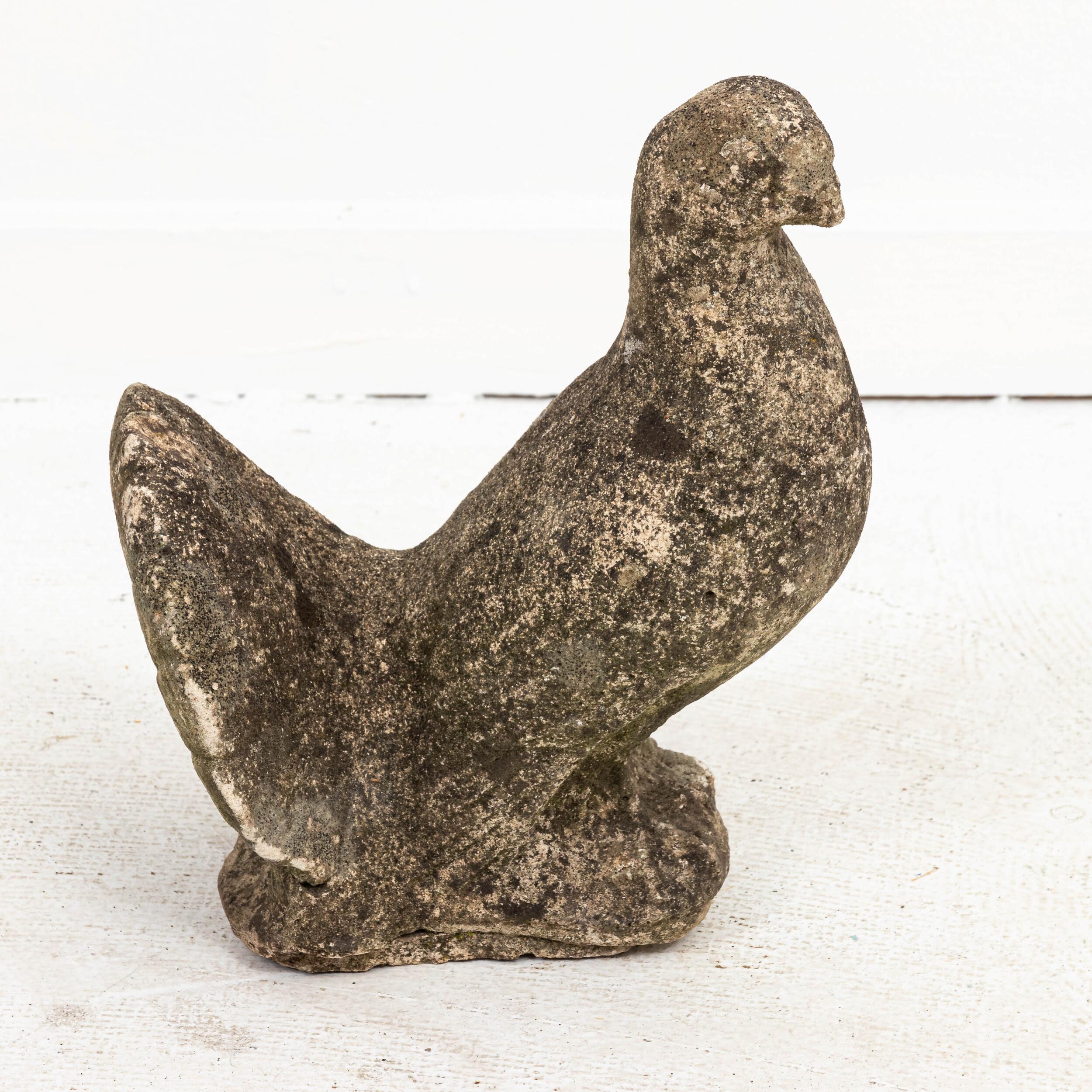 Unique cast stone garden statue in the shape of a pigeon or dove. Made in England in the early 20th century, this charming statue adds a playful element to the landscape. Good condition, weathered with age and exposure to the elements. Original