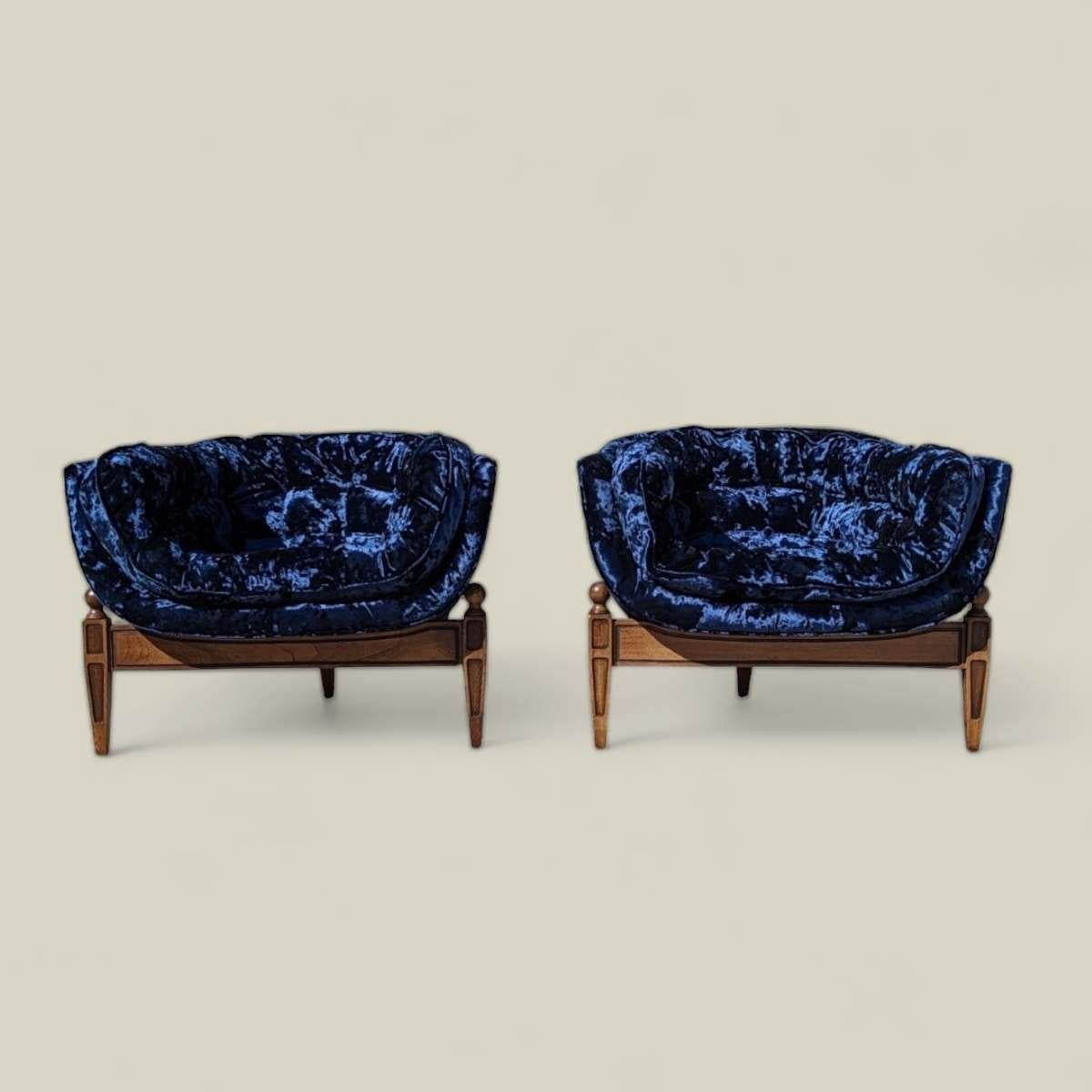 Elevate your home décor with these exquisite Vintage Castro Convertibles Blue Velvet Armchairs, a timeless example of mid-century modern design. Crafted circa 1960s, these low-profile scoop lounge chairs have been expertly re-upholstered in a