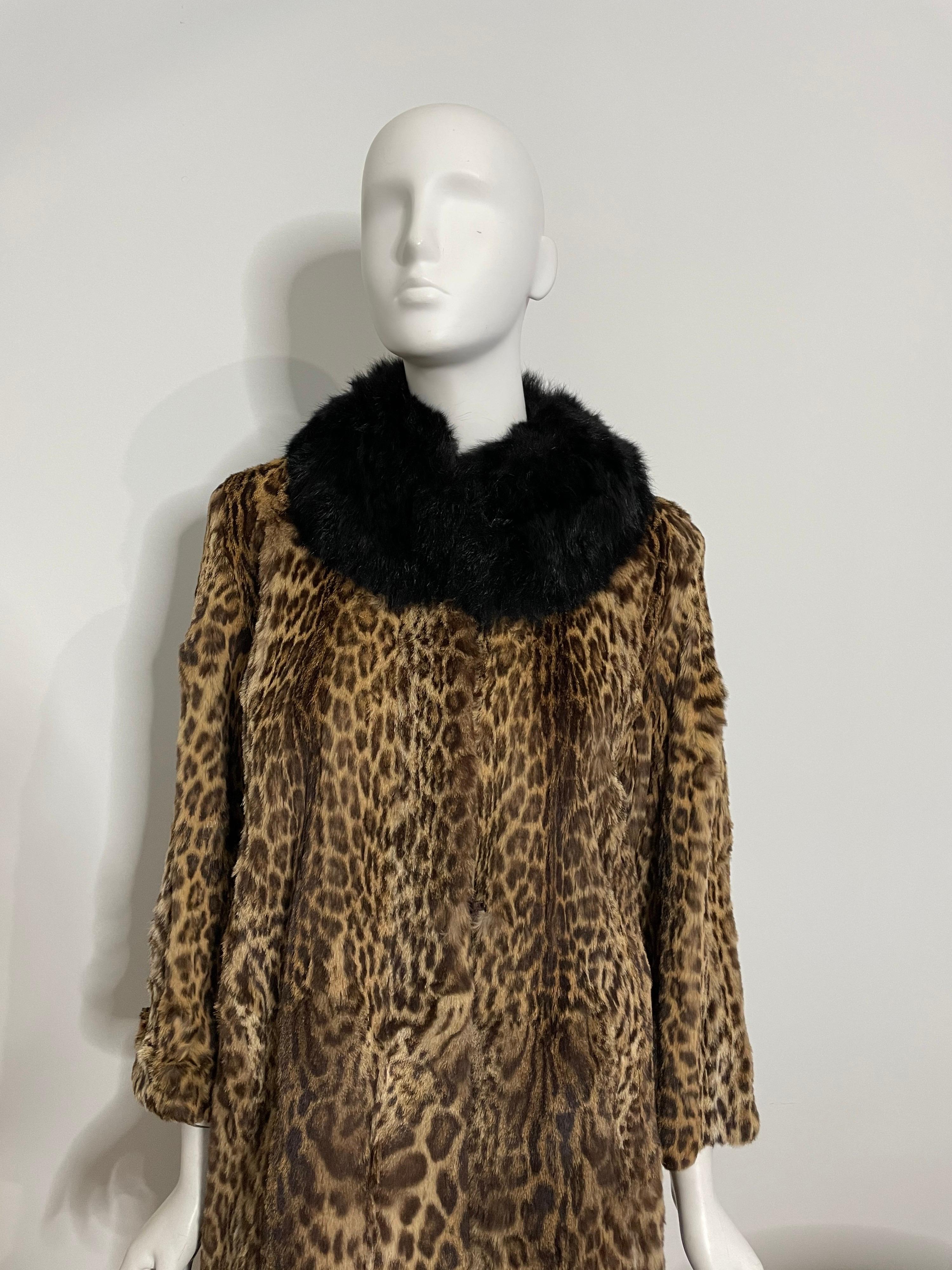 Stunning, supple leopard print on a sheared fur. Has attached black fur, not mink, maybe a fox. This is shown on a dress form that is a size 2-4 and there is room. Please refer to the measurements to compare them to something that fits you. *Up to