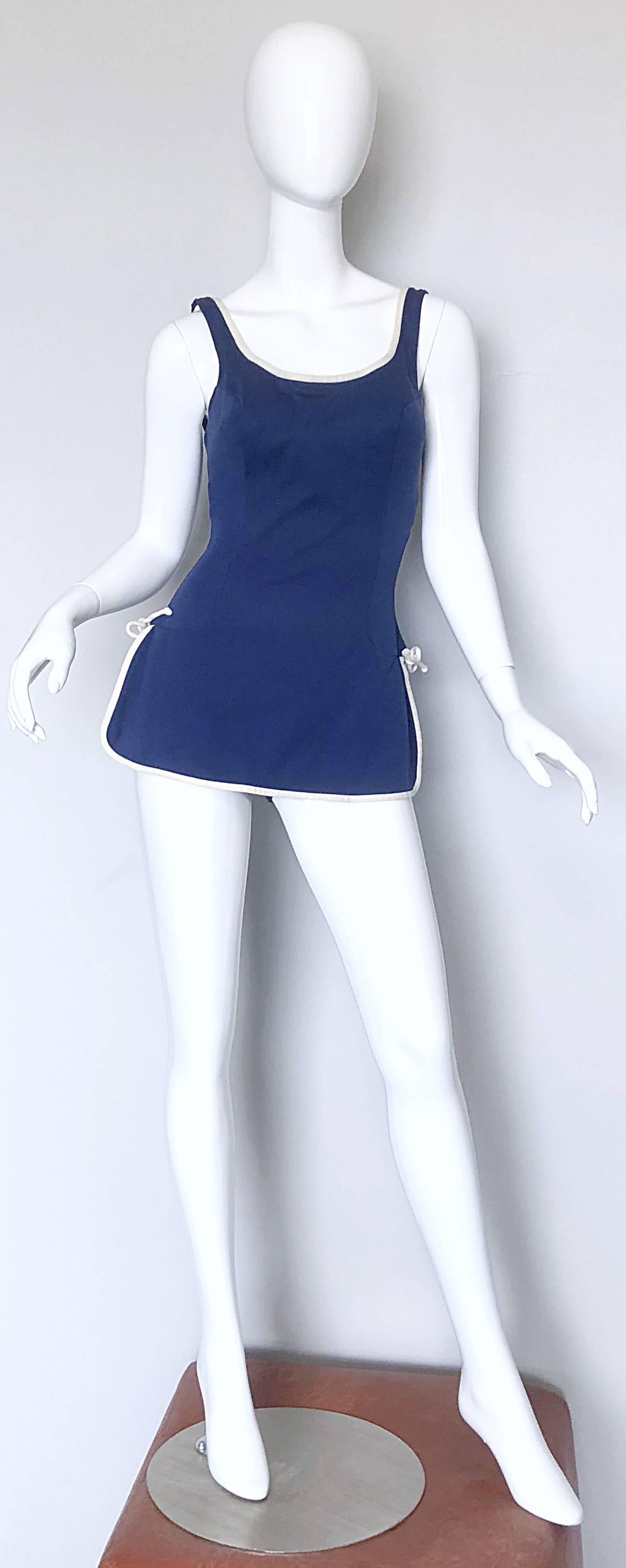 Chic 1960s CATALINA navy blue and white one-piece romper swimsuit! Flattering durable stretch material slims any silhouette. White ties at each side of the waist. Simply slips over the head, and stretches to fit. Perfect for the beach, the pool or