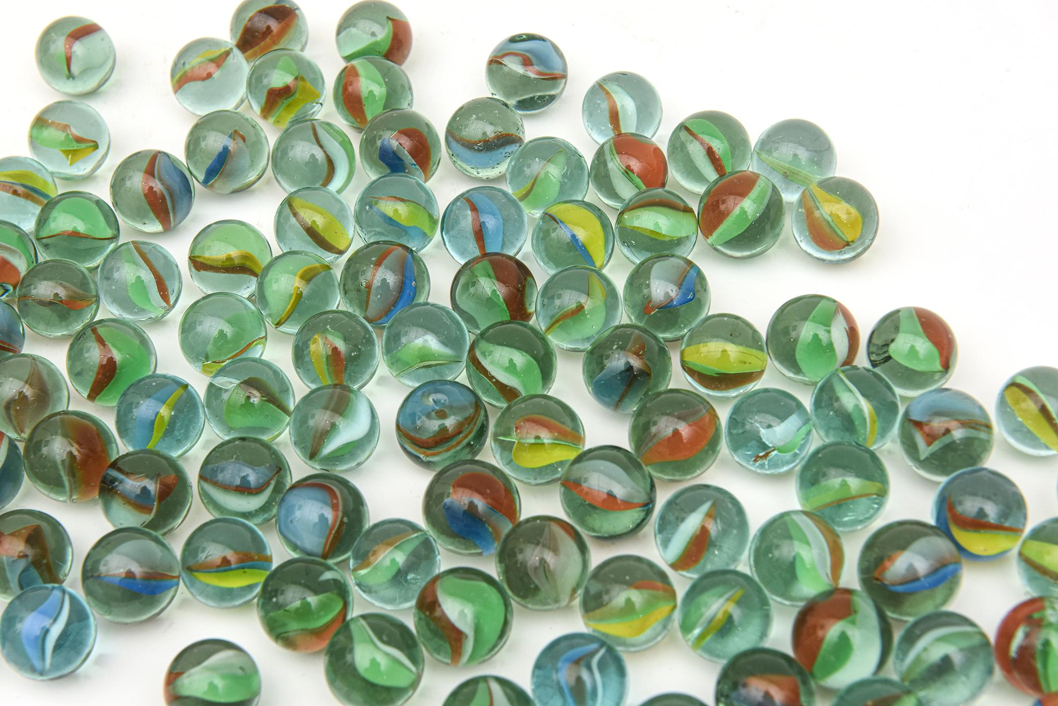 This delightful collection of cats eye vintage marbles are vintage from the 50's. There are 234 of them and sold as the collection only. The colors are beautiful of greens, blues, red and varying shades. The marble dish they were photographed on