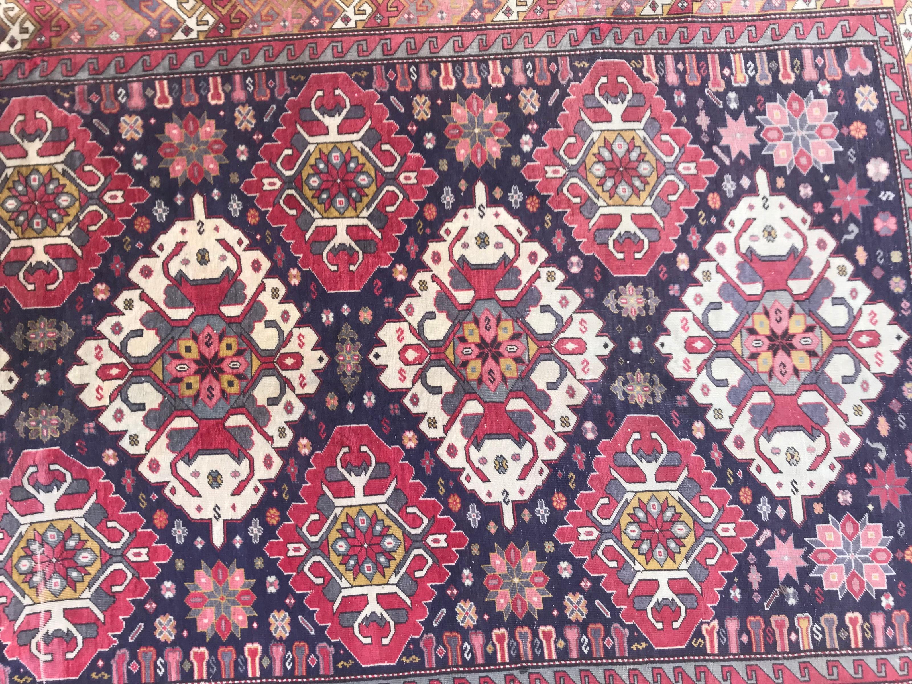 Beautiful mid-20th century large Azebaijan rug with a nice Karabagh design and nice colors with blue, orange, grey, yellow. Pink and purple, entirely hand knotted with wool velvet on cotton foundation.