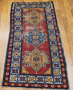 Vintage Handwoven Caucasian Kazak Area Rug with Three Medallions