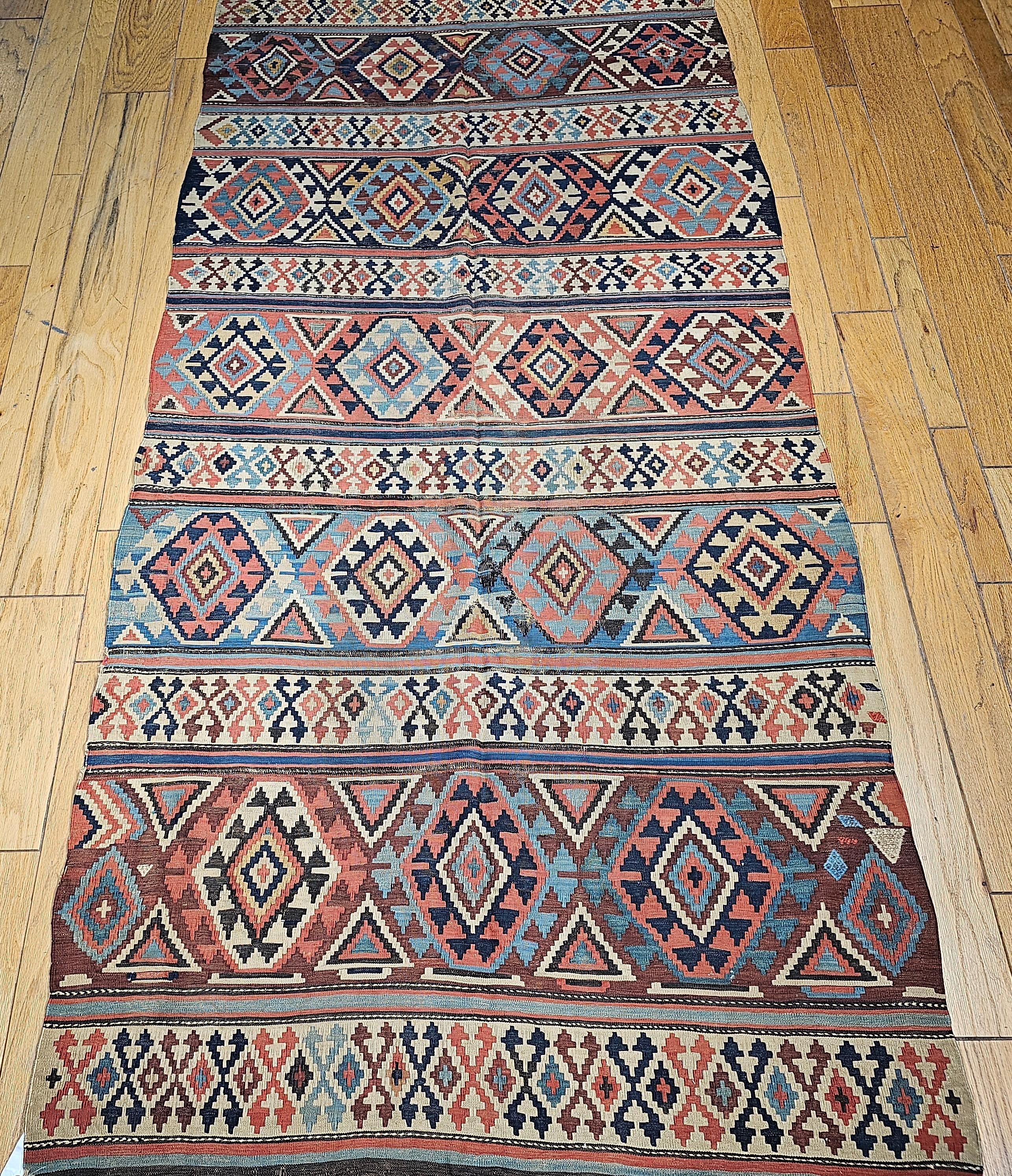 19th Century Caucasian Kazak kilim in ivory, rust, green, blue, and navy. Since Kilims are tapestry type flatweaves (no pile), finding one that is over 125 years in such a great condition is extremely rare. This Caucasian Kilim is a stripe pattern
