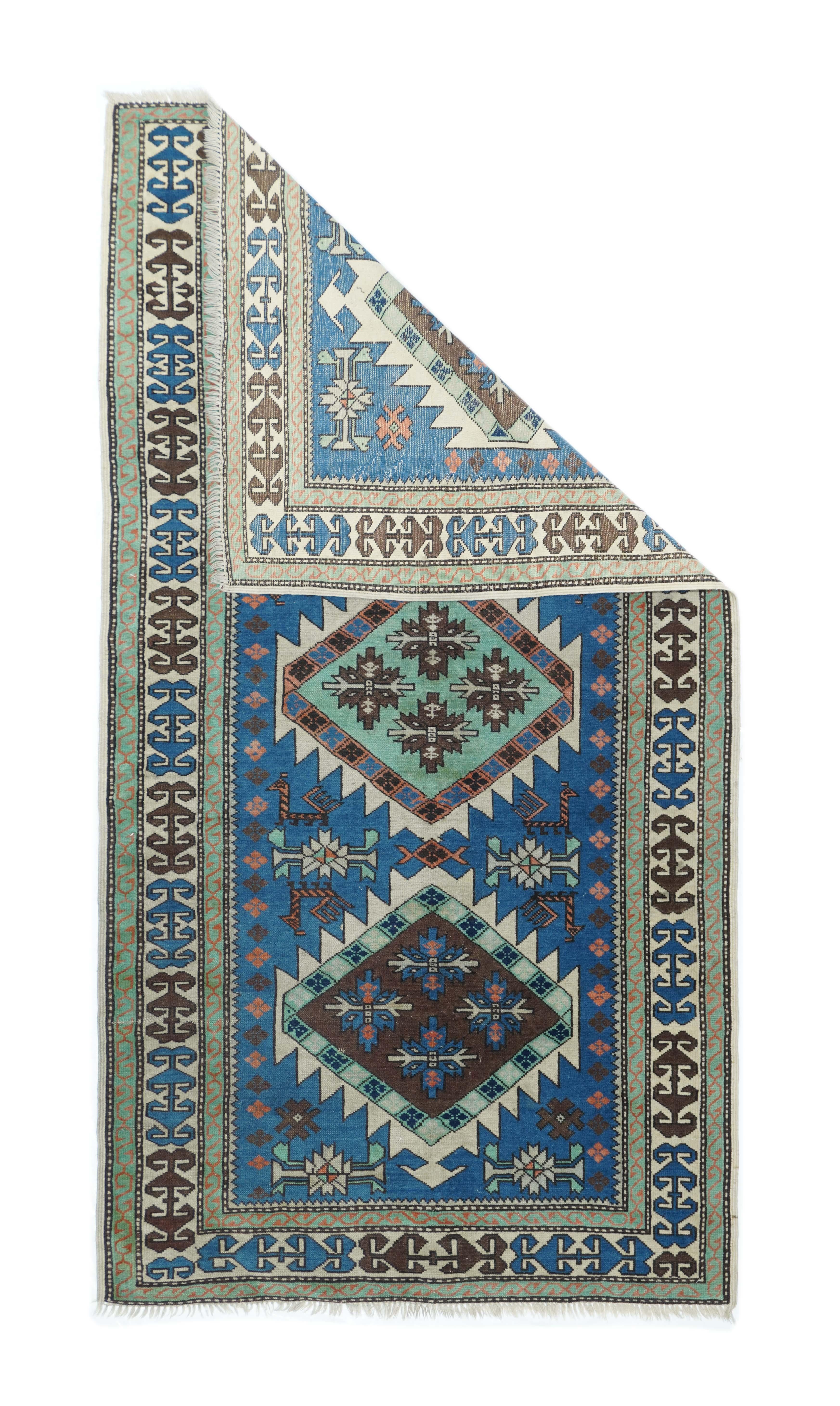 Vintage Caucasian rug measures: 3'6'' x 6'9''.
