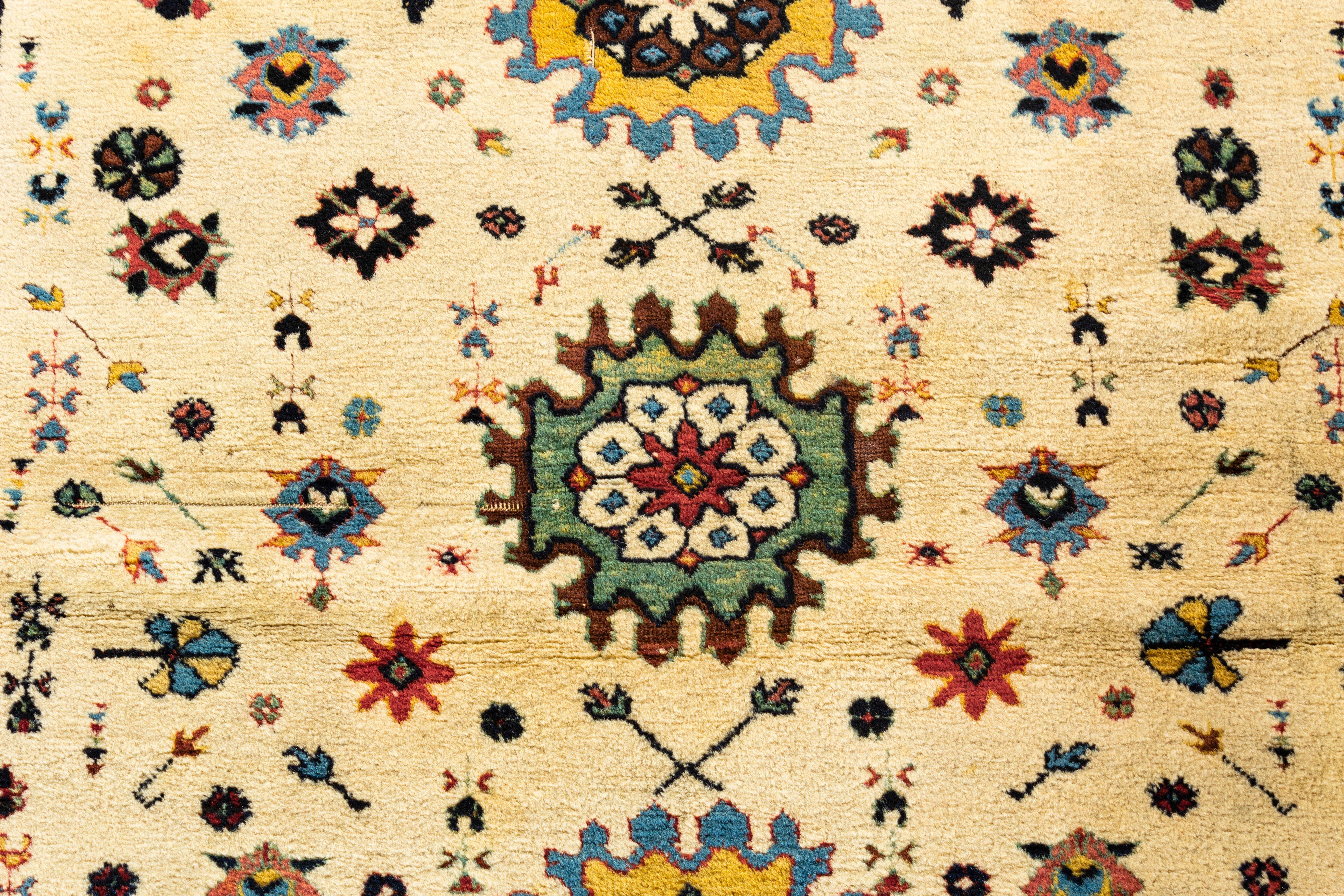 Vintage Caucasian rug, circa 1920. These types of antique Caucasian rugs were woven in the eastern part of the region, mostly along the west coast of the Caspian Sea. They display intricate designs, often in prayer (niche) formats; shorter, often