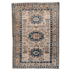 Vintage Caucasian Rug with Cream Ground and Deep Blue Star Medallions