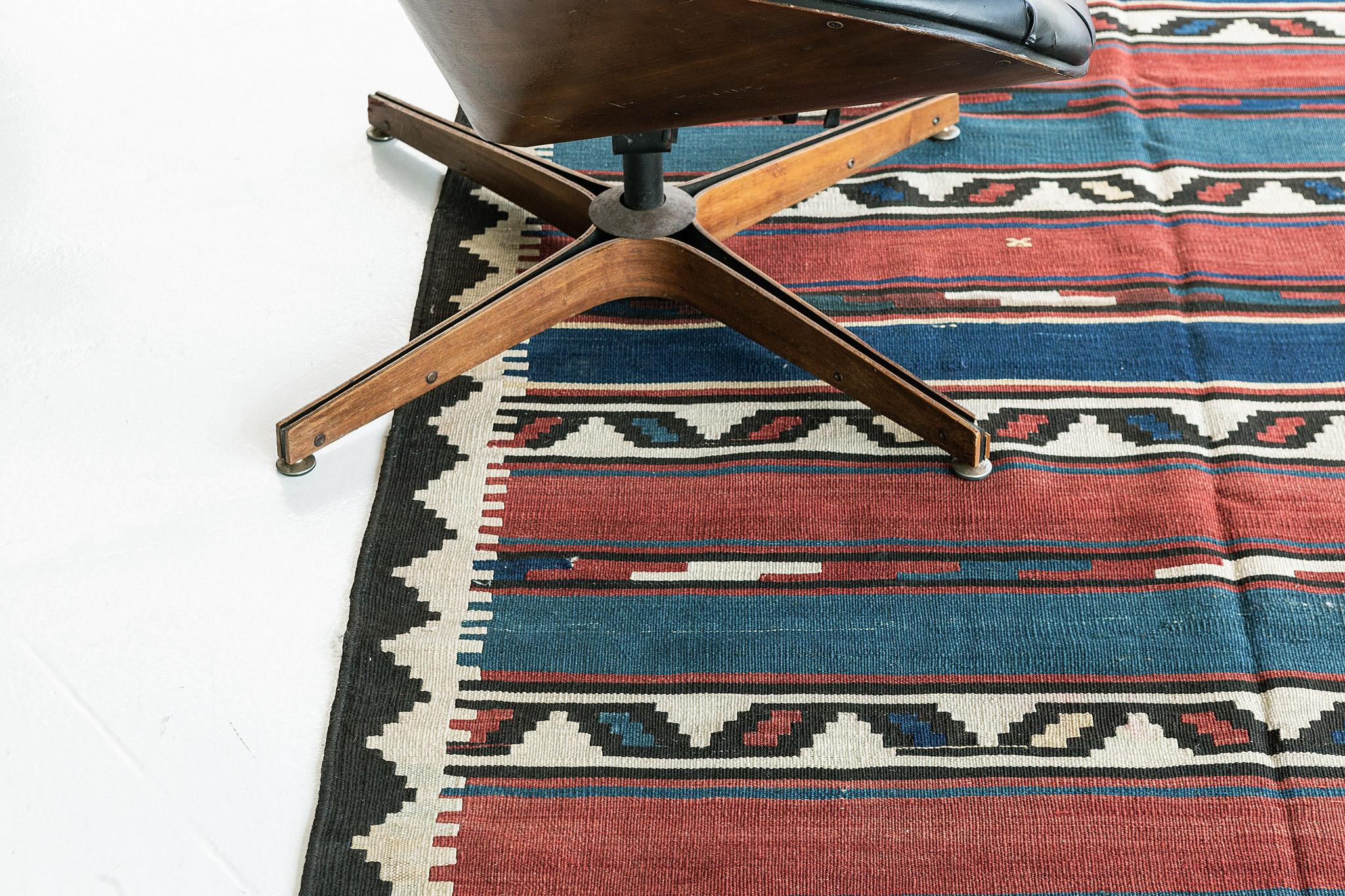 Behold and catch a glimpse of the elegance of the Caucasian Shirvan rug from our timeless collection. Tones of indigo, maroon, and cream featured the alternates and outline details of Shirvan symbols. Furniture that having a boho-chic and even