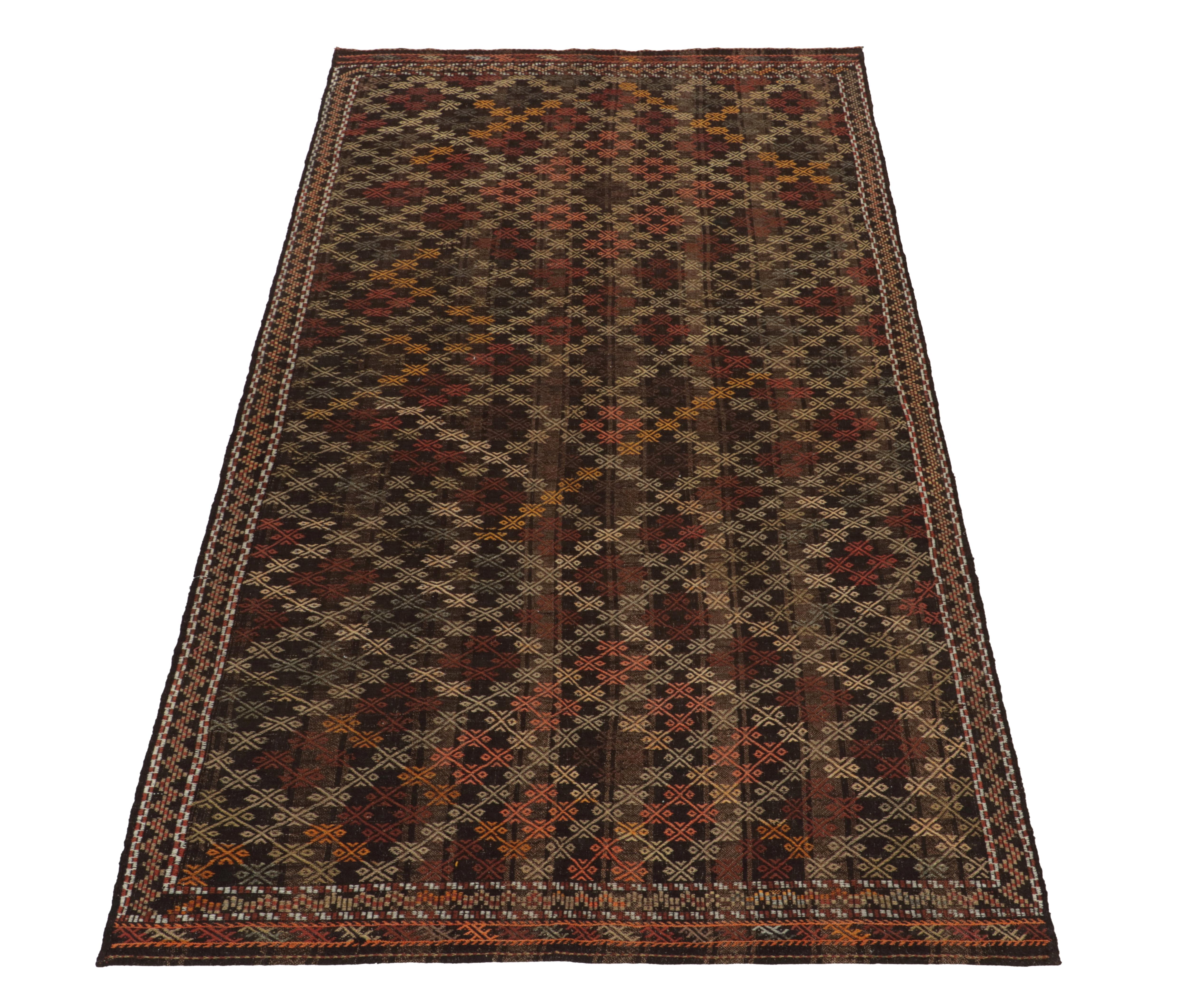 Of the coveted Kurdish style, this 6 x 12 Cecim kilim rug of Anatolian rug lineage enjoys a special place in our collection. This vintage mid-century flatweave from Turkey features an impeccably embroidered diamond pattern alternating in tones of