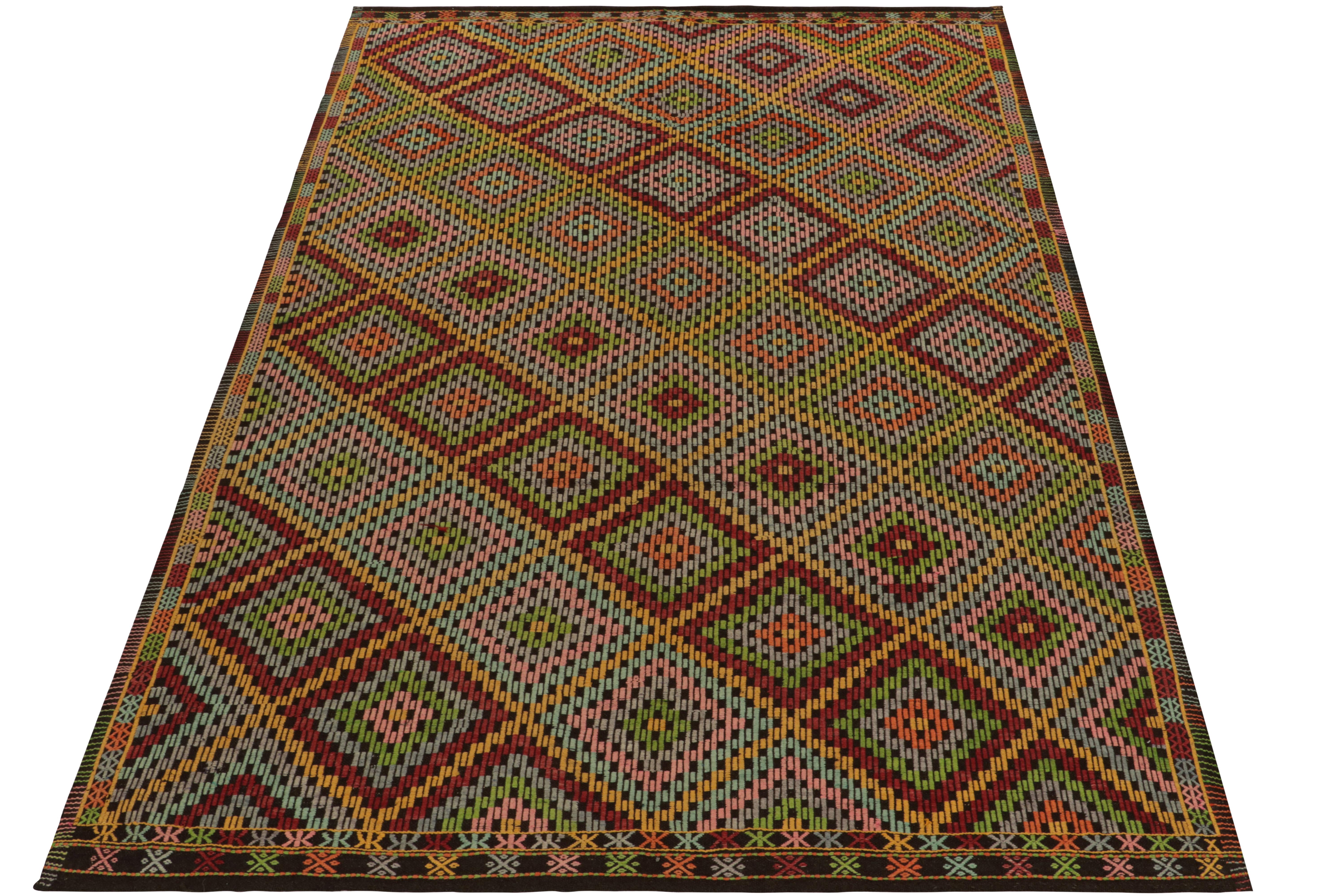 Inspired by the celebrated Kurdish style, this 7x10 Cecim kilim rug of Anatolian sensibility enjoys a prestigious position in our tribal collection. This vintage mid-century flatweave from Turkey features an embroidered lattice pattern manifesting
