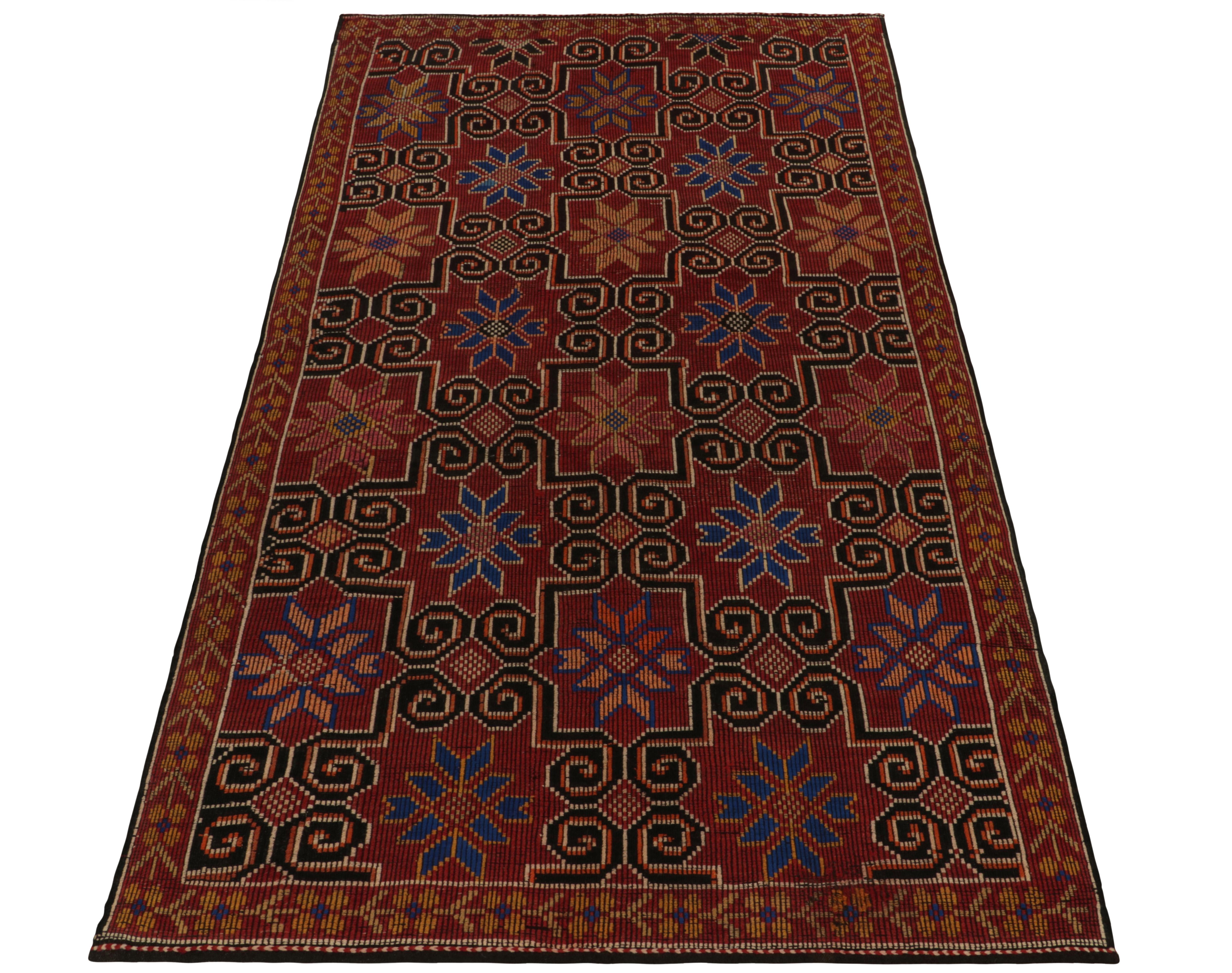 From the celebrated Kurdish style, this vintage 6x10 Cecim kilim remarks a special new curation joining our flatweave collection. This vintage mid-century flatweave from Turkey enjoys fine embroidery in maroon, gold & black with blue lining further
