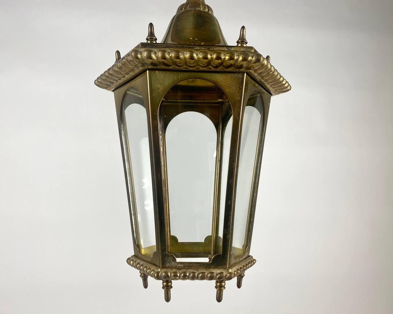 Small vintage 6 sided bronze and glass ceiling lantern. 

Very beautiful decorative bronze lantern-chandelier with six glass panels. The gold paint on the lantern looks delightful.

Decorate your ceiling with Mid-20th Century lantern.

This