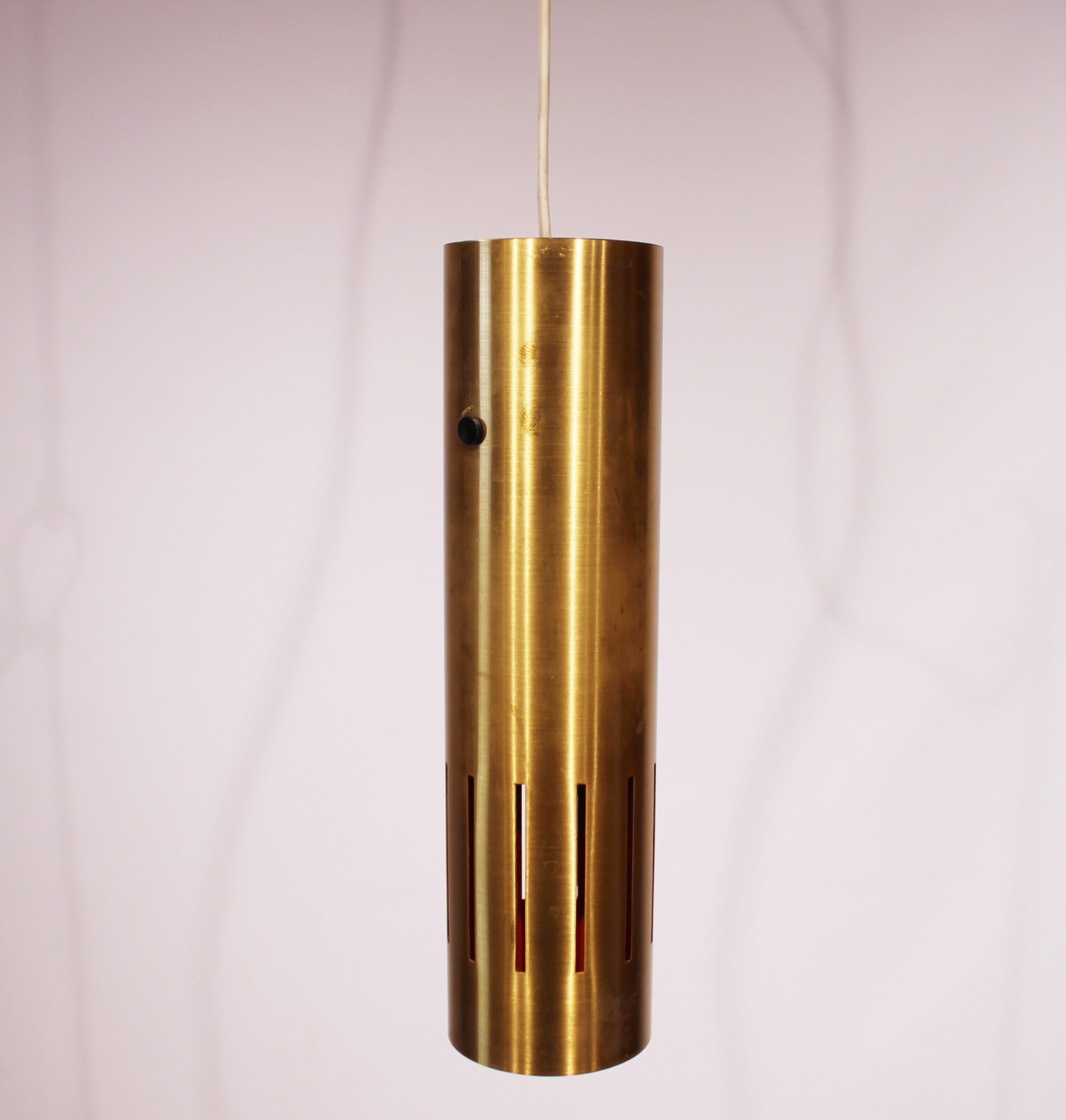 Vintage ceiling pendant in brass and orange lacquer interior of Danish design from the 1970s. The lamp is in great vintage condition.