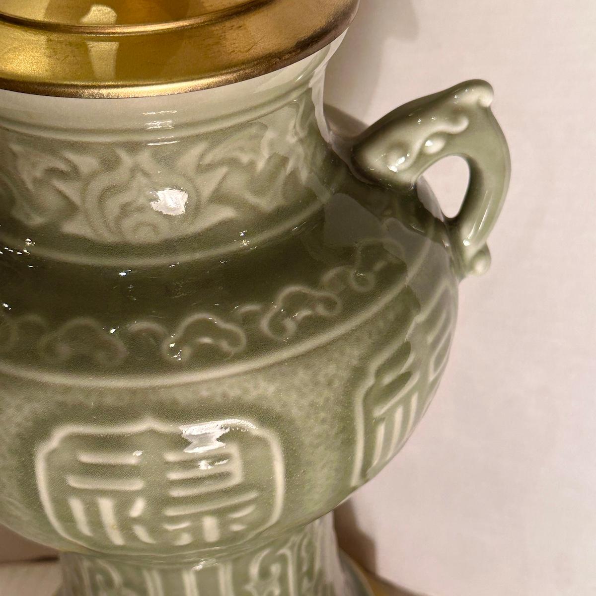 A circa 1950's Chinese celadon porcelain lamp with gilt base.

Measurements:
Height of body: 16