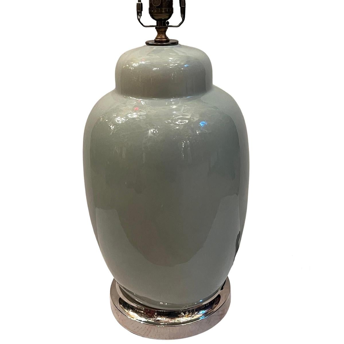 A circa 1950's French celadon porcelain lamp with silver base.

Measurements:
Height of body: 17.25