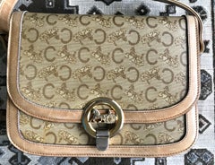 Vintage Celine beige macadam and blason pattern shoulder bag with golden motif.