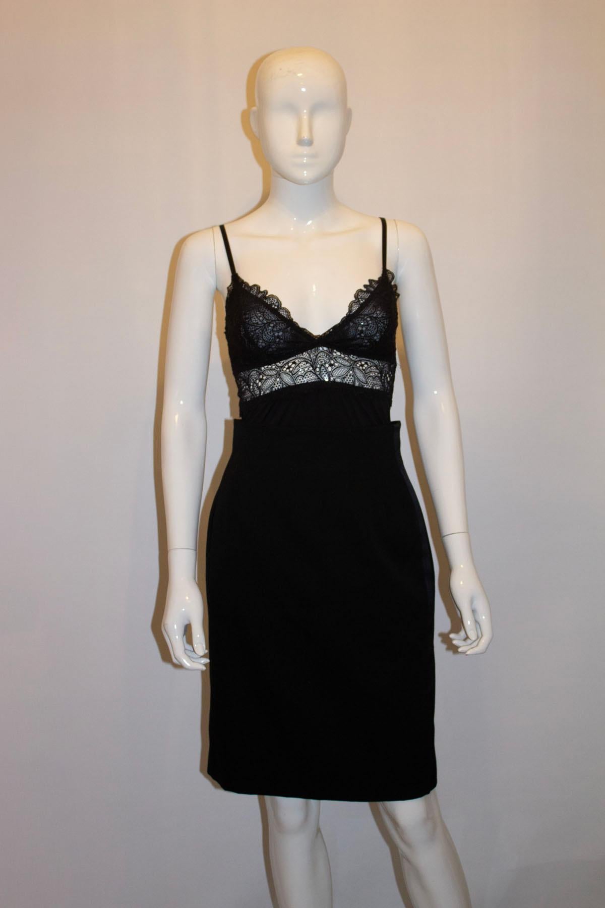  A super chic , vintage , black tuxedo skirt by Celine. In a black wool with ribbon detail along each side, the skirt has wonderful tailoring , and a back central zip. It is fully lined. 
Made in France, Size 38 Measurements: waist 27'', length 23'