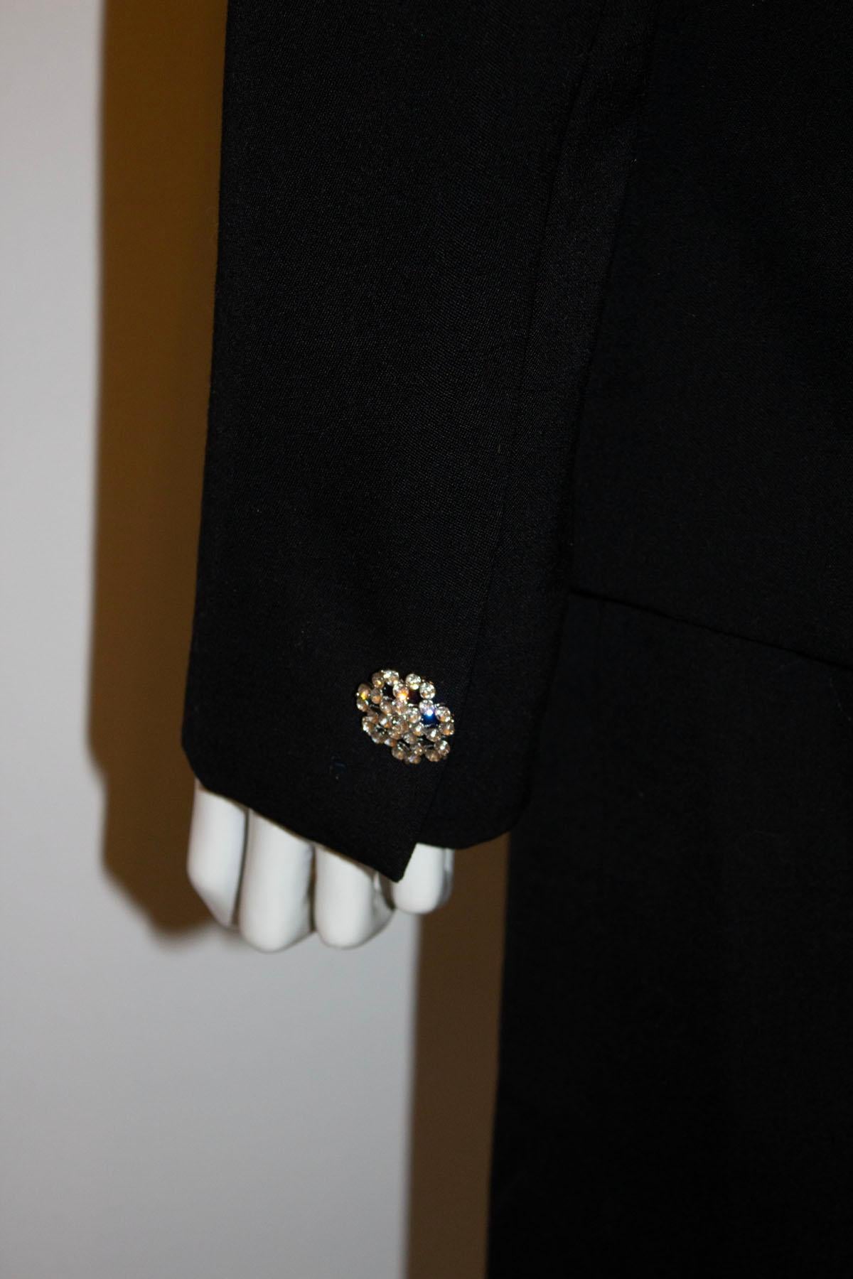 A stunning vintage skirt suit by Celine.  The suit is in fine wool and the jacket has a a single attractive button fastening on the front and single buttons on the cuff. It has pleats on the shoulder , and sloping pockets on either side. The skirt