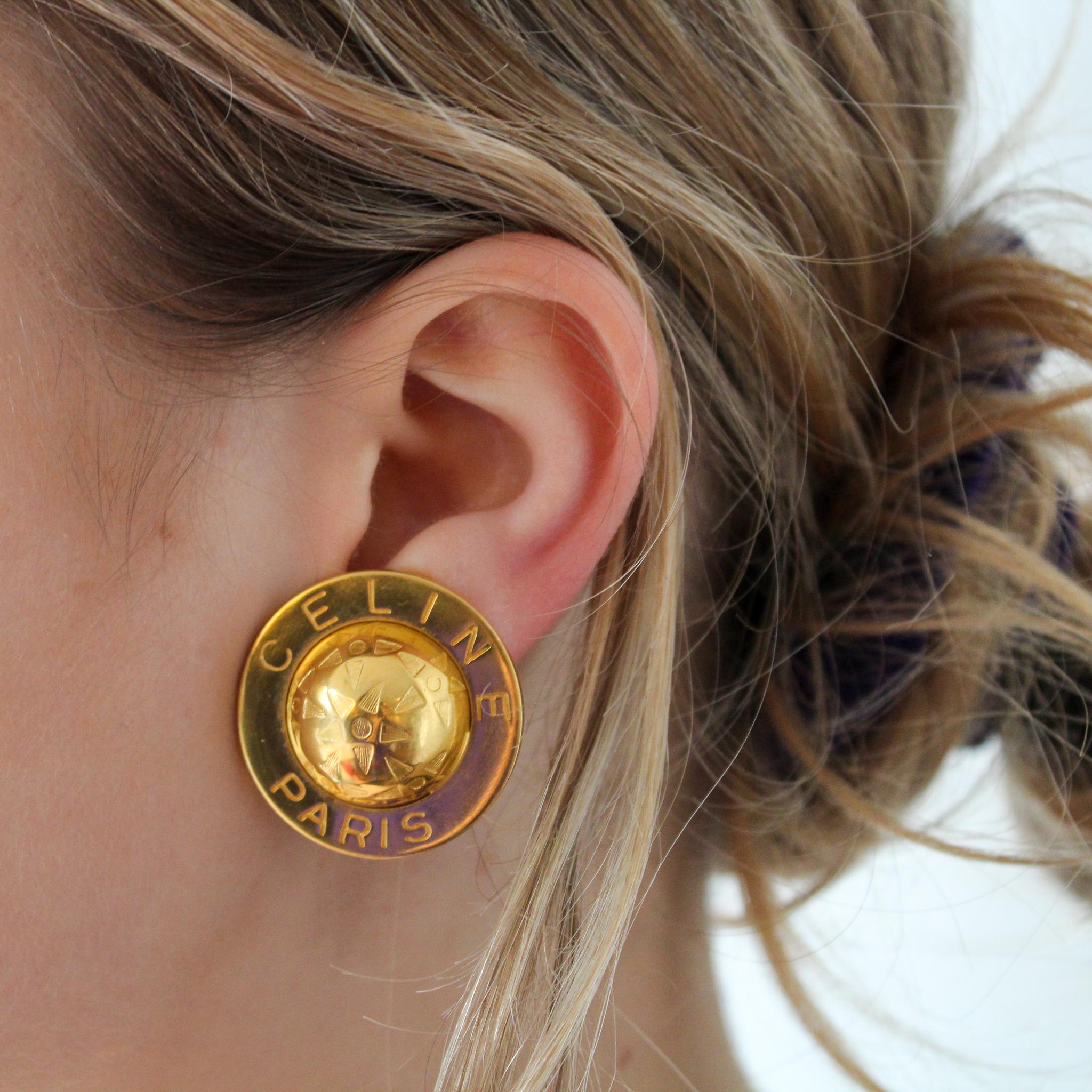 Celine 1980s Vintage Clip On Earrings

Super cool statement vintage earrings with contemporary styling. An iconic design from the late 80s Celine archive. Made in France in 1989 from gold plated metal featuring the iconic globe symbol

Céline was