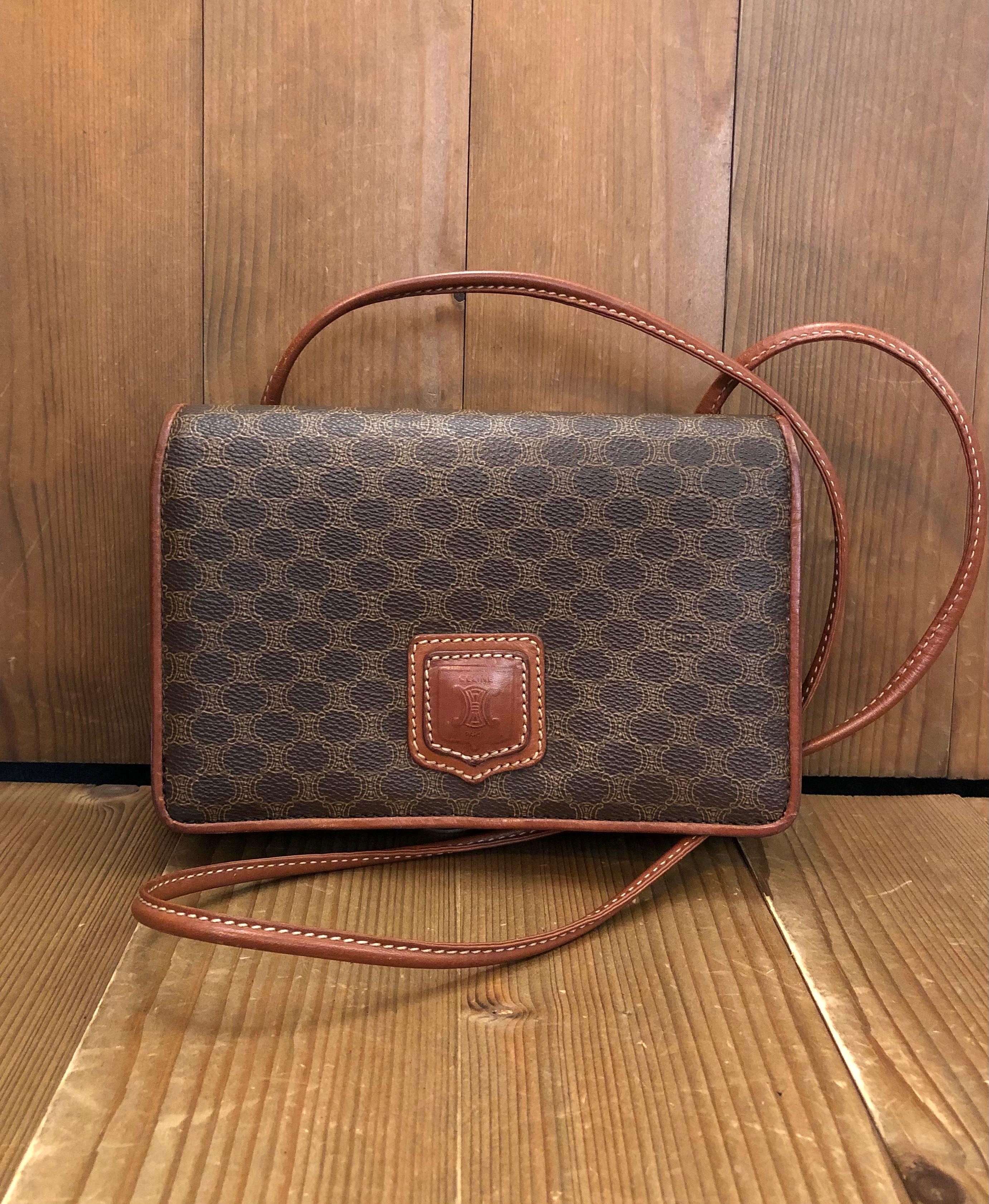 This vintage CELINE mini crossbody bag is crafted of Celine’s iconic Macadam coated canvas in brown trimmed with brown leather. This mini crossbody features a leather strap sewn to the back. Front flap magnetic snap closure open to a beige interior