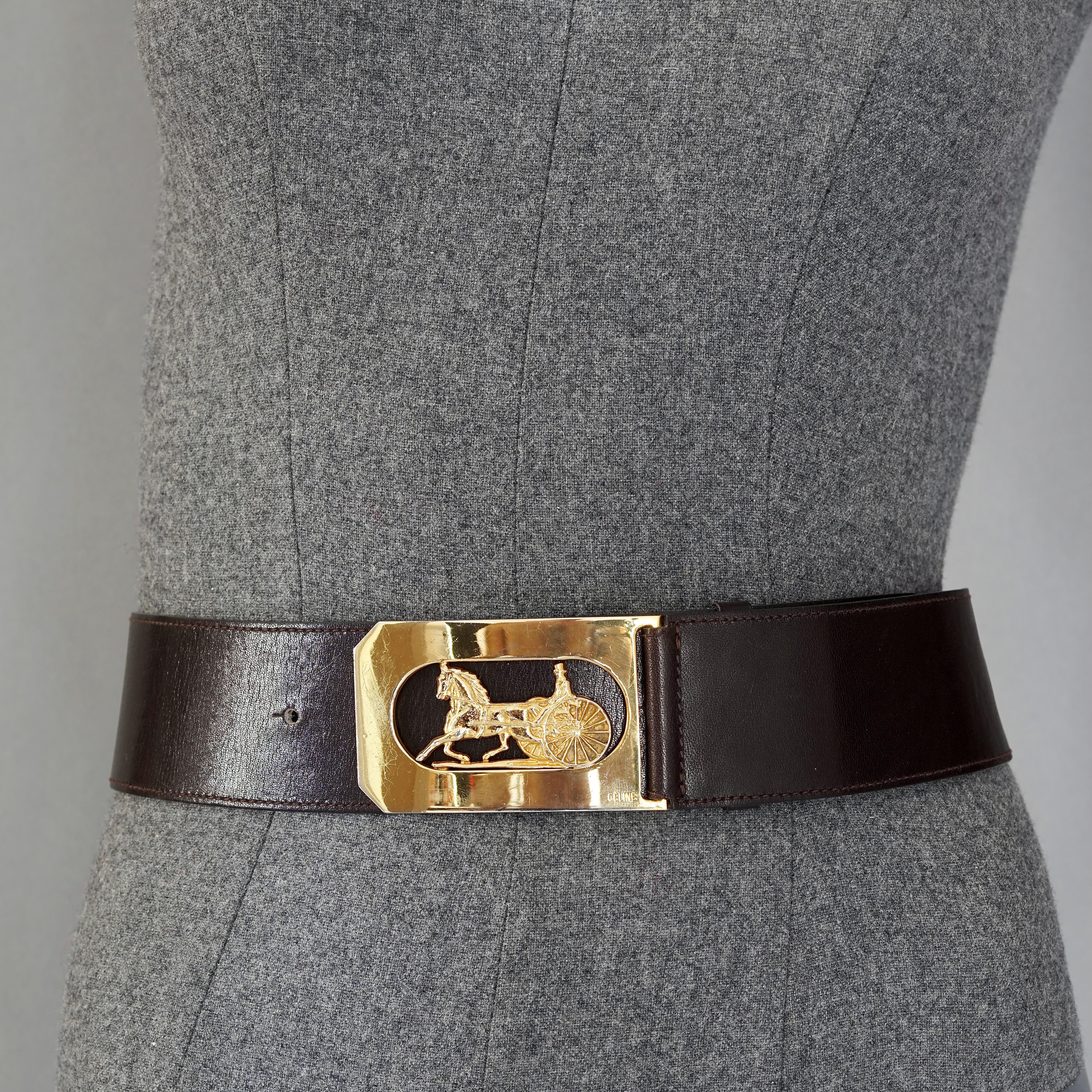 Vintage CELINE PARIS Horse Carriage Buckle Dark Brown Leather Belt

Measurements:
Buckle Height: 1.97 inches (5 cm)
Buckle Width: 3.15 inches (8 cm cm)
Strap Height: 1.97 inches (5 cm)
Wearable Length: 25.98 inches to 31.89 inches (66 cm to 81
