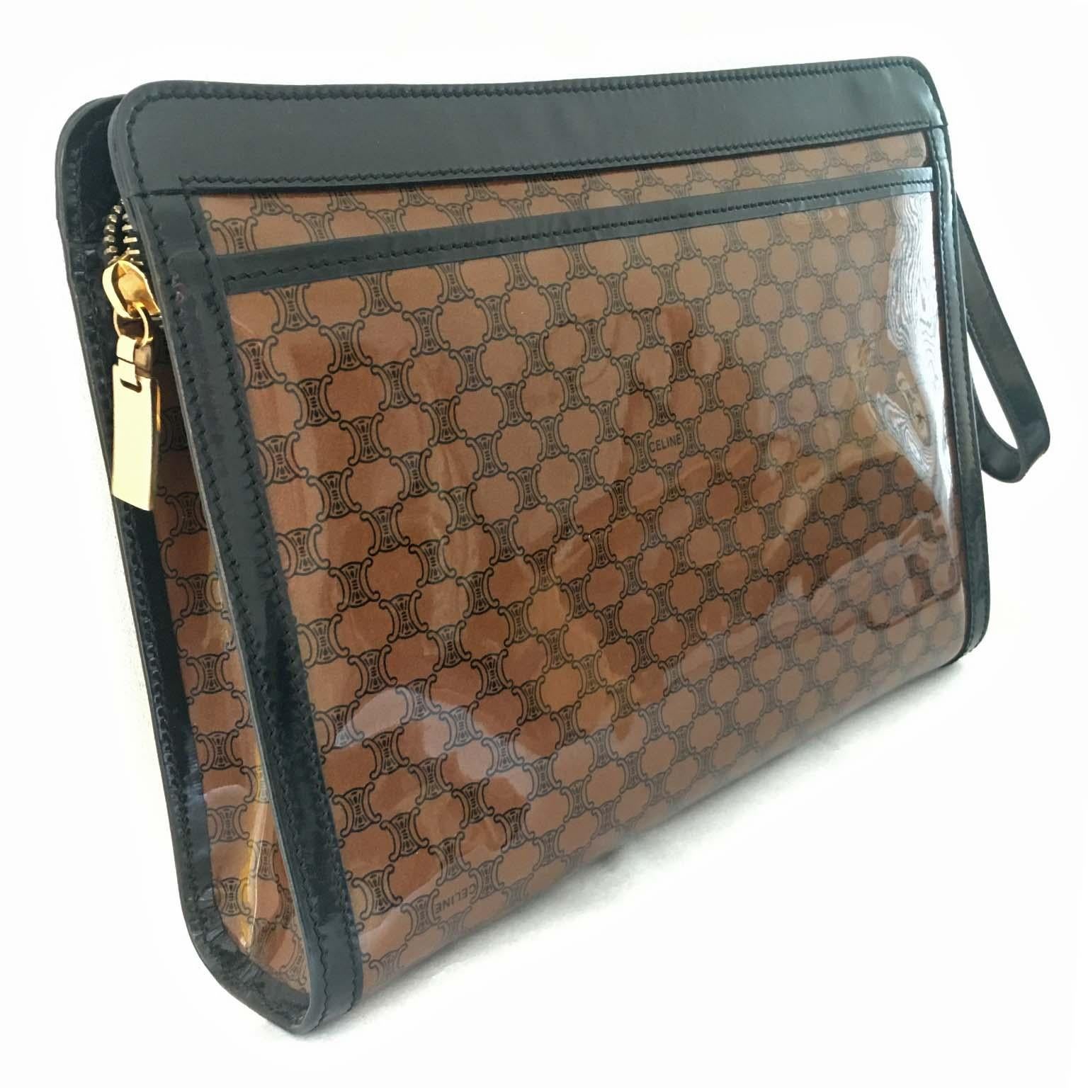 Vintage Céline macadam logo clutch bag purse from circa 1980s. 
Gold tone hardware and black textile lining. Includes original dust bag. 
measurements: 
20 x 28 x 5 cm 